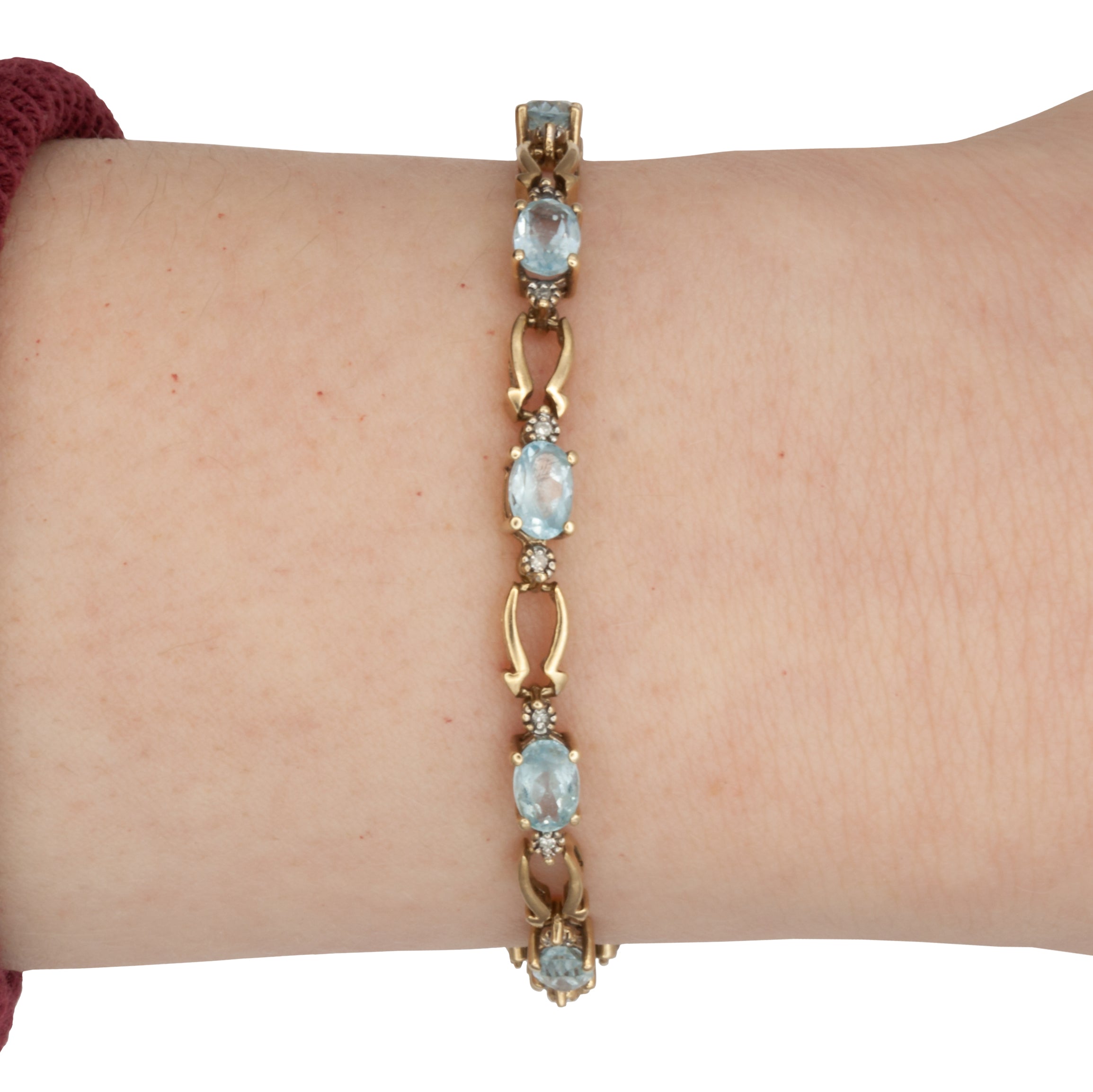 A 9ct gold blue topaz and diamond bracelet