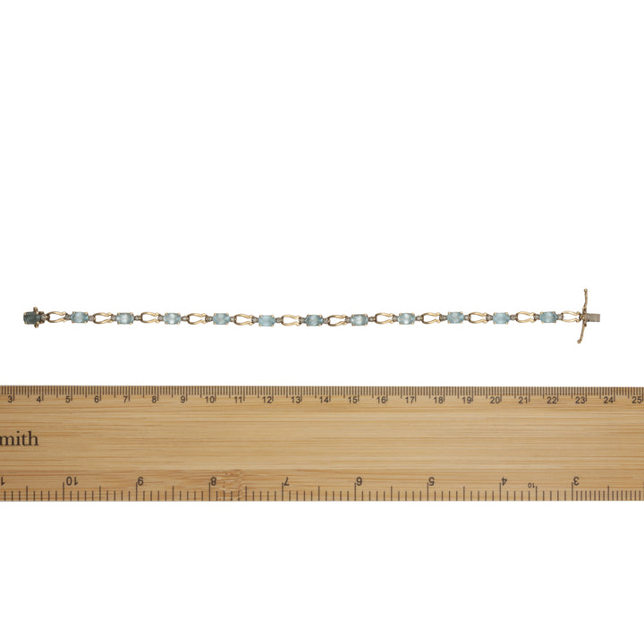 A 9ct gold blue topaz and diamond bracelet