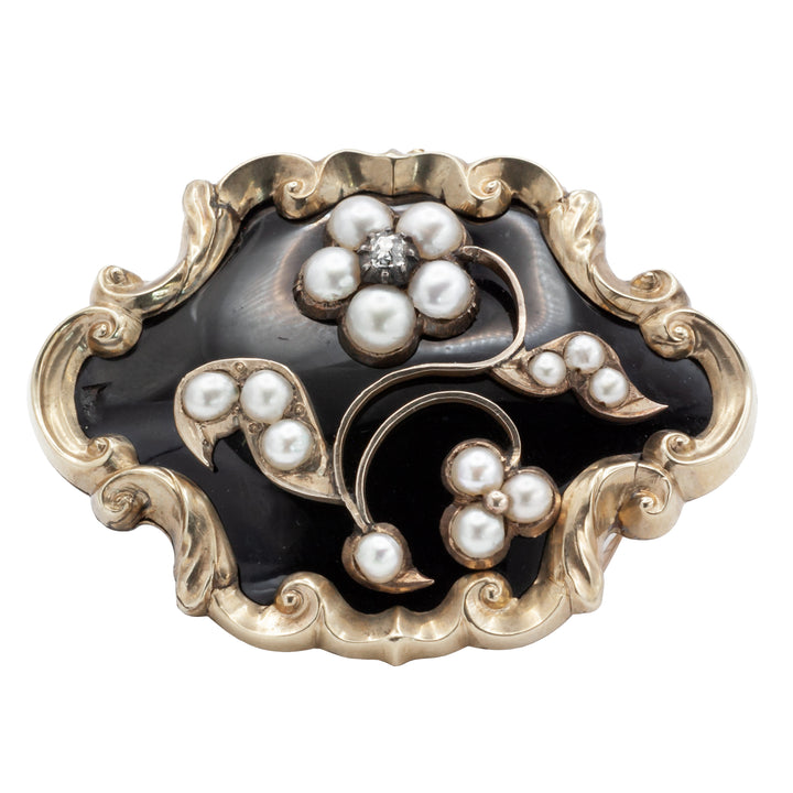 A Victorian diamond, onyx, and seed Pearl mourning brooch