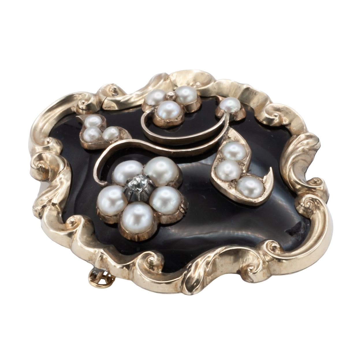 A Victorian diamond, onyx, and seed Pearl mourning brooch
