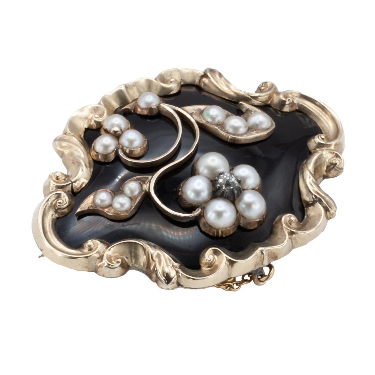 A Victorian diamond, onyx, and seed Pearl mourning brooch