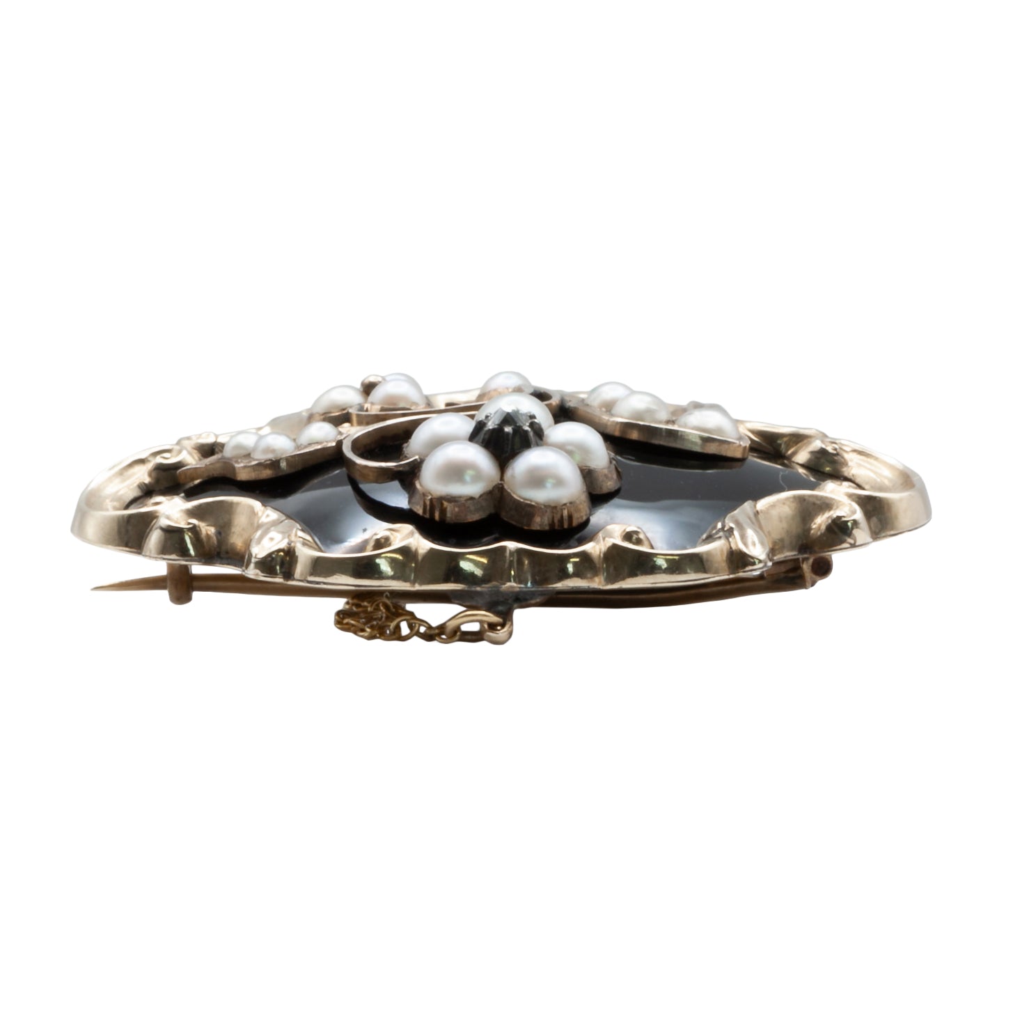 A Victorian diamond, onyx, and seed Pearl mourning brooch