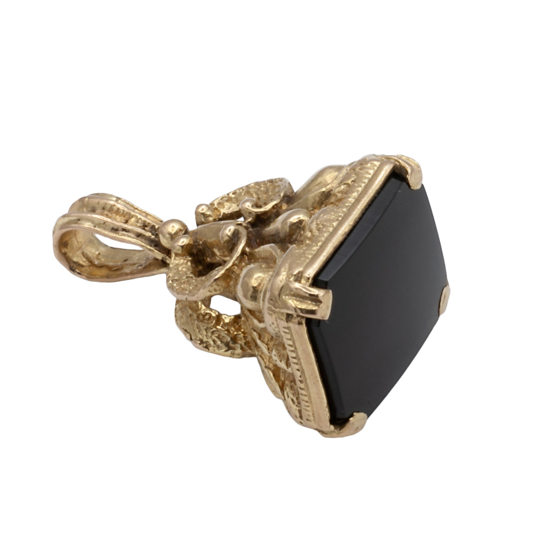 An Antique 9ct gold onyx fob