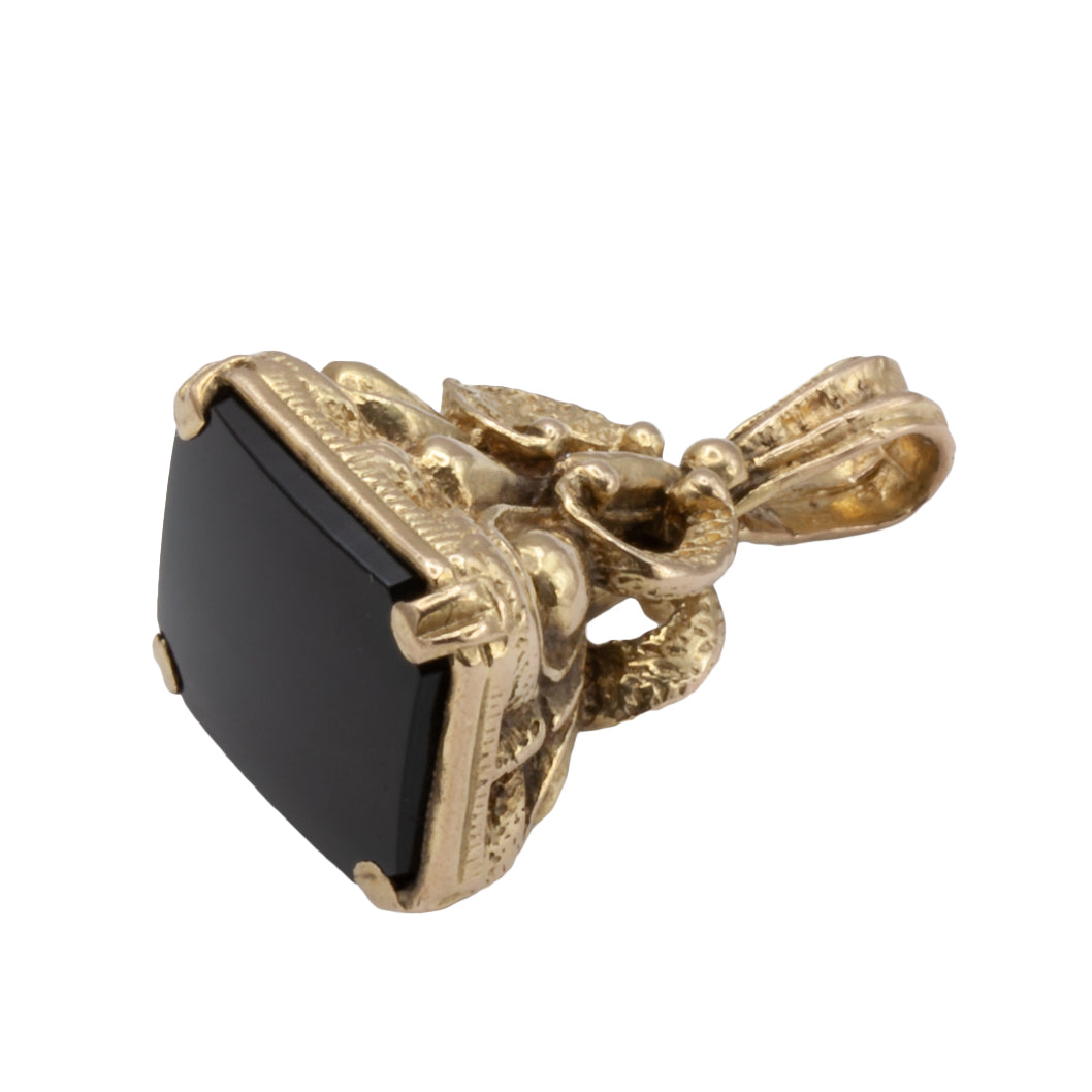 An Antique 9ct gold onyx fob