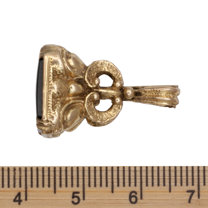 An Antique 9ct gold onyx fob
