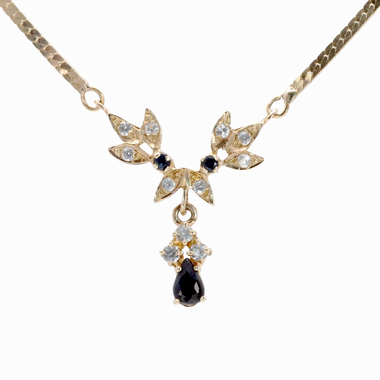 A 14ct gold sapphire and spinel necklace.
