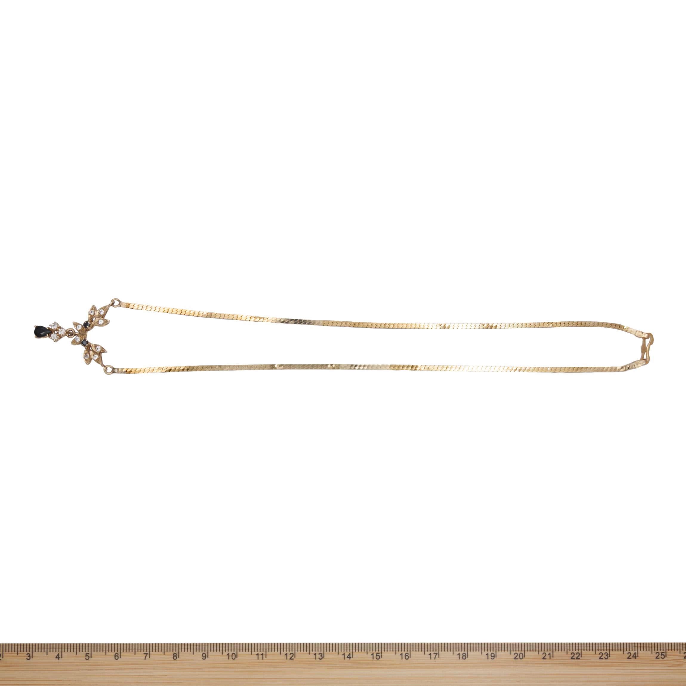 A 14ct gold sapphire and spinel necklace.