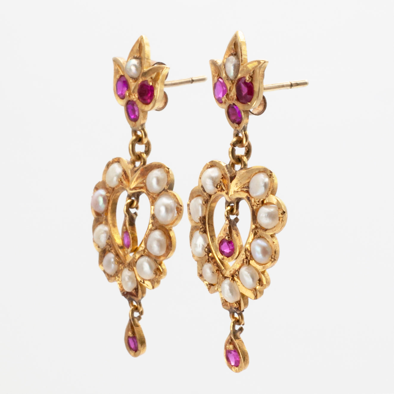 An antique pair of 9ct gold ruby and seed pearl earrings