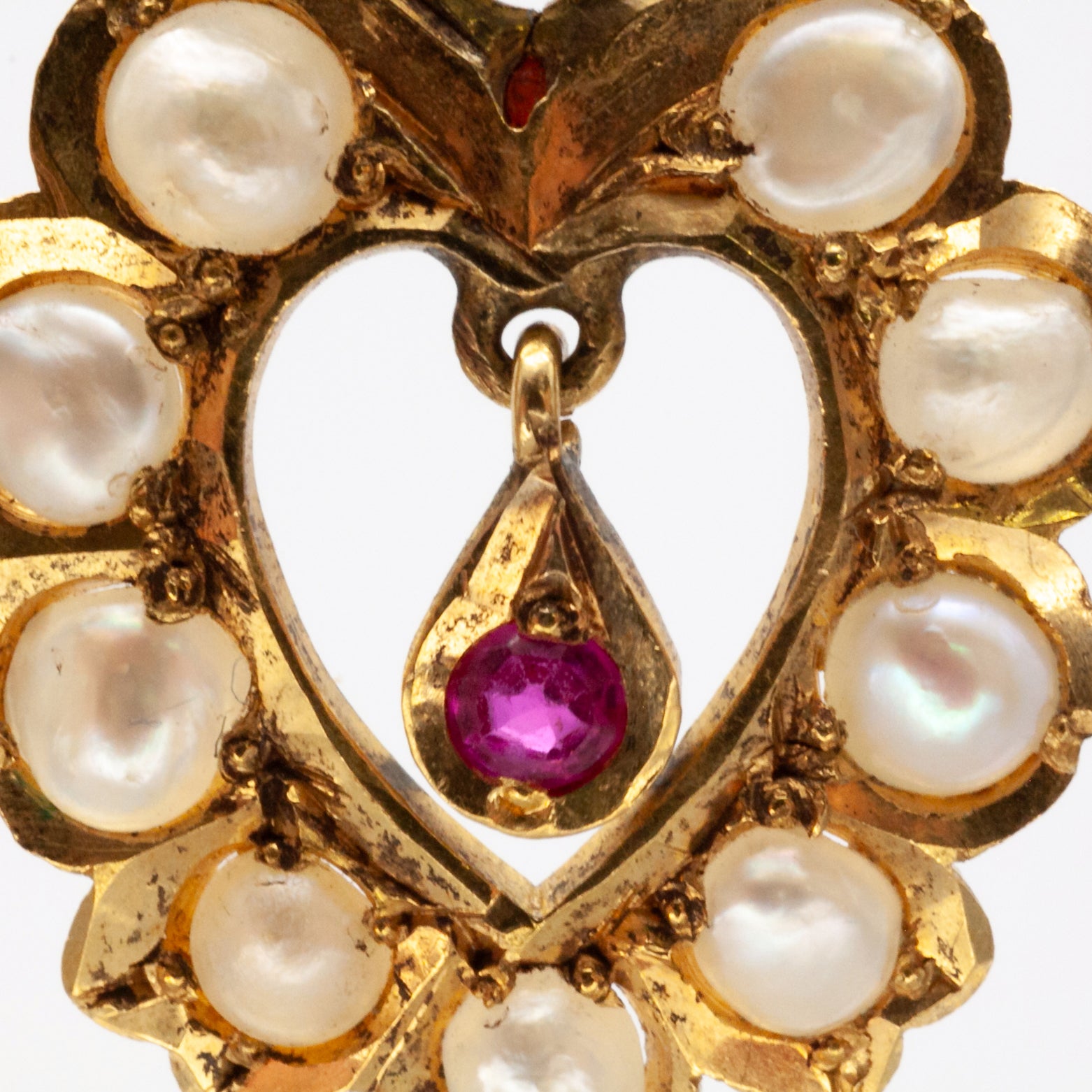 An antique pair of 9ct gold ruby and seed pearl earrings