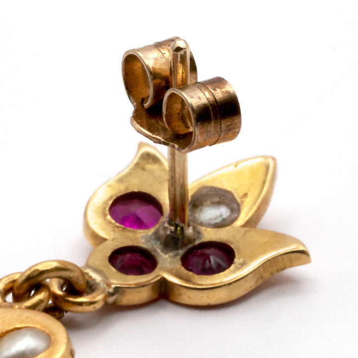 An antique pair of 9ct gold ruby and seed pearl earrings