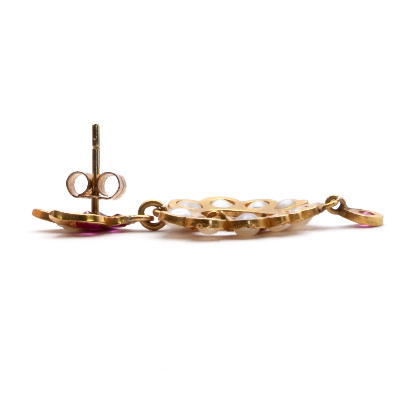 An antique pair of 9ct gold ruby and seed pearl earrings