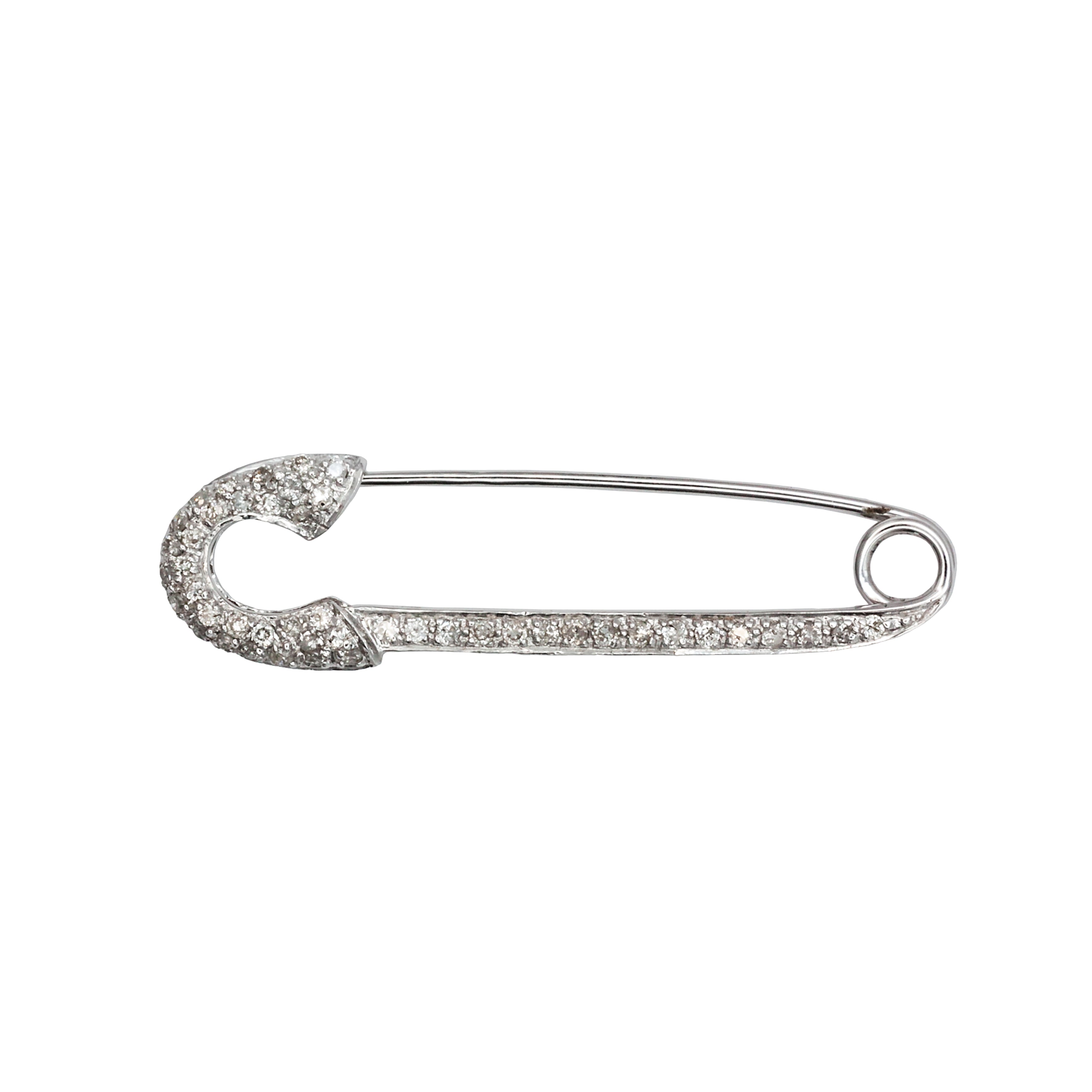 An antique 18ct white gold diamond safety pin brooch.