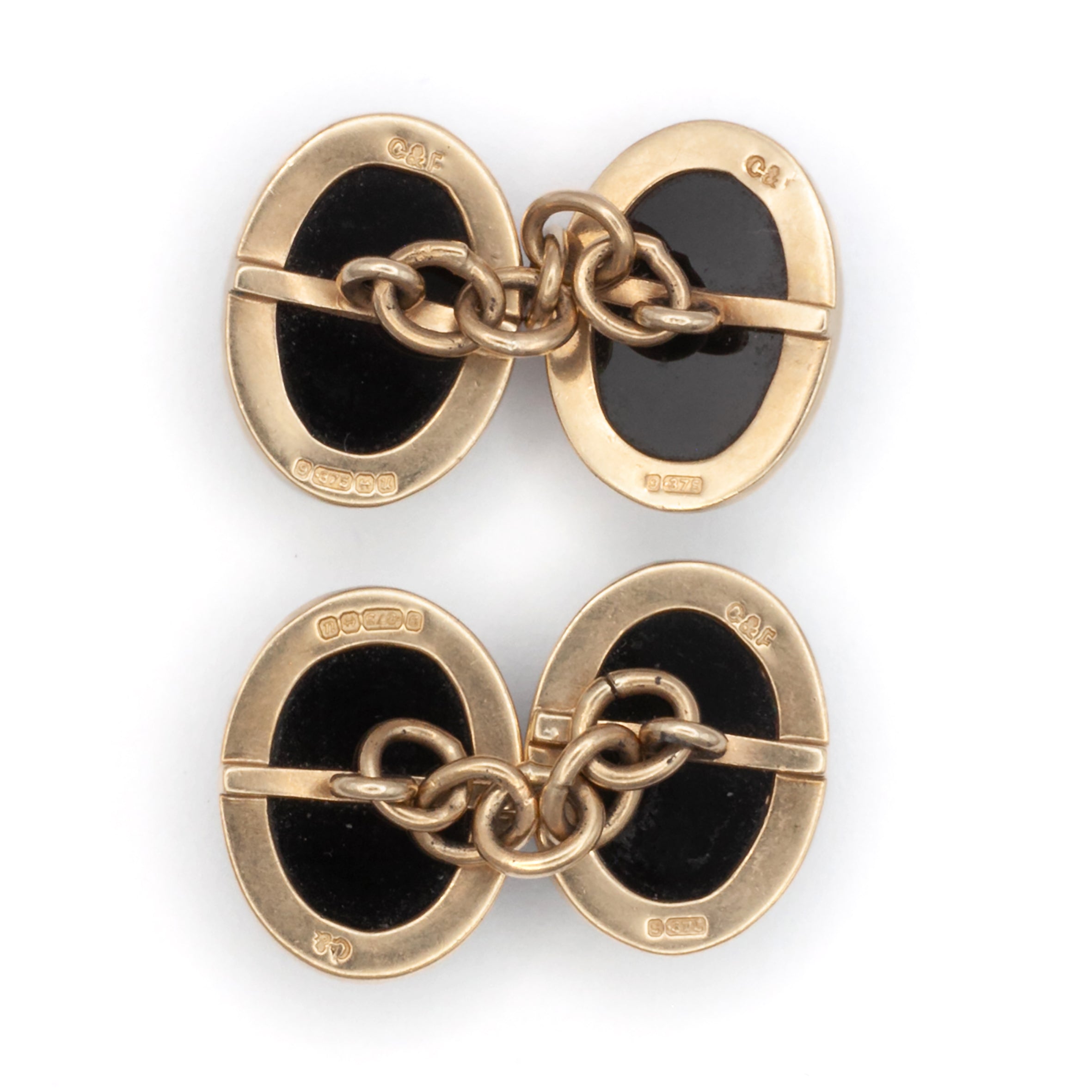 A vintage pair of 9ct gold onyx cuff links