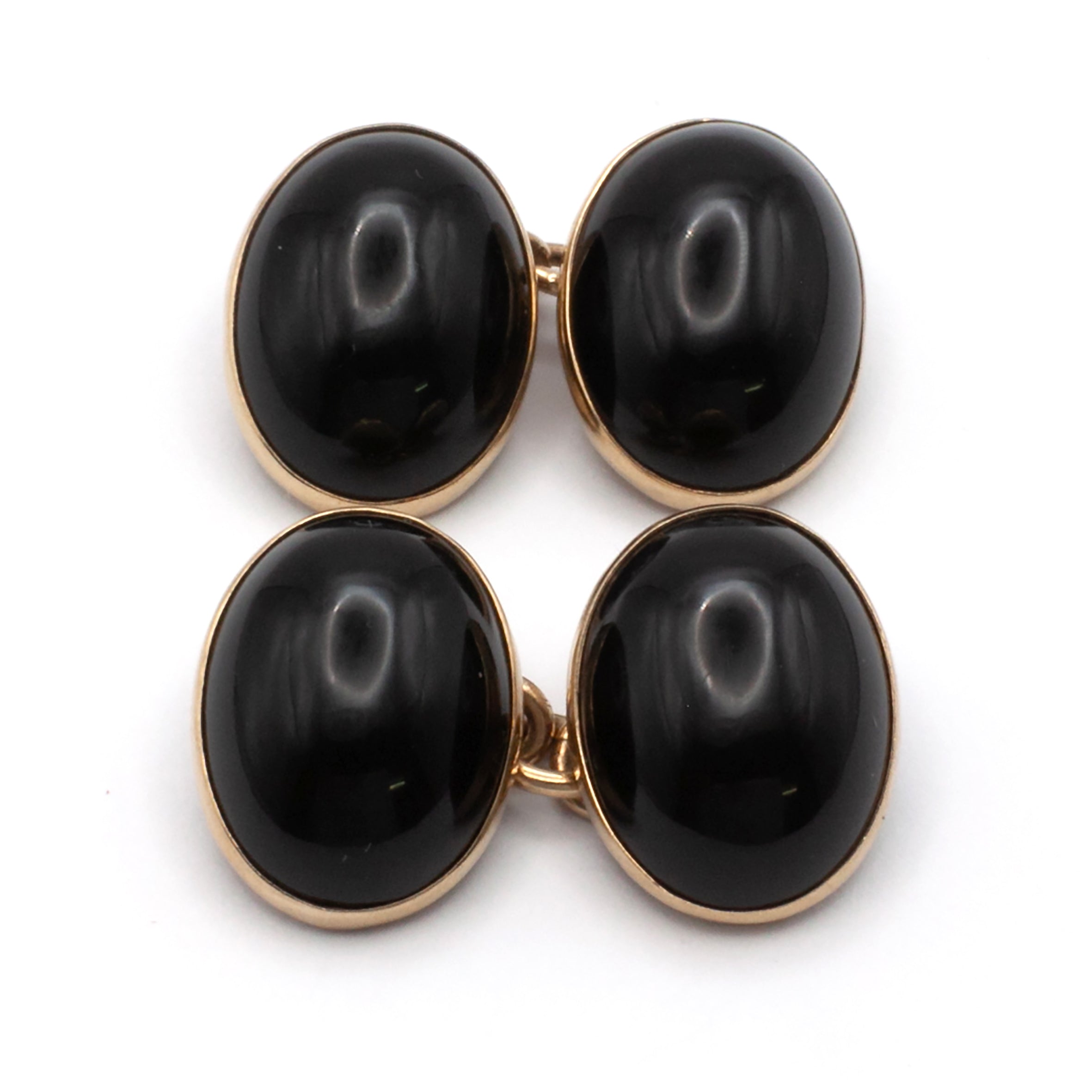 A vintage pair of 9ct gold onyx cuff links