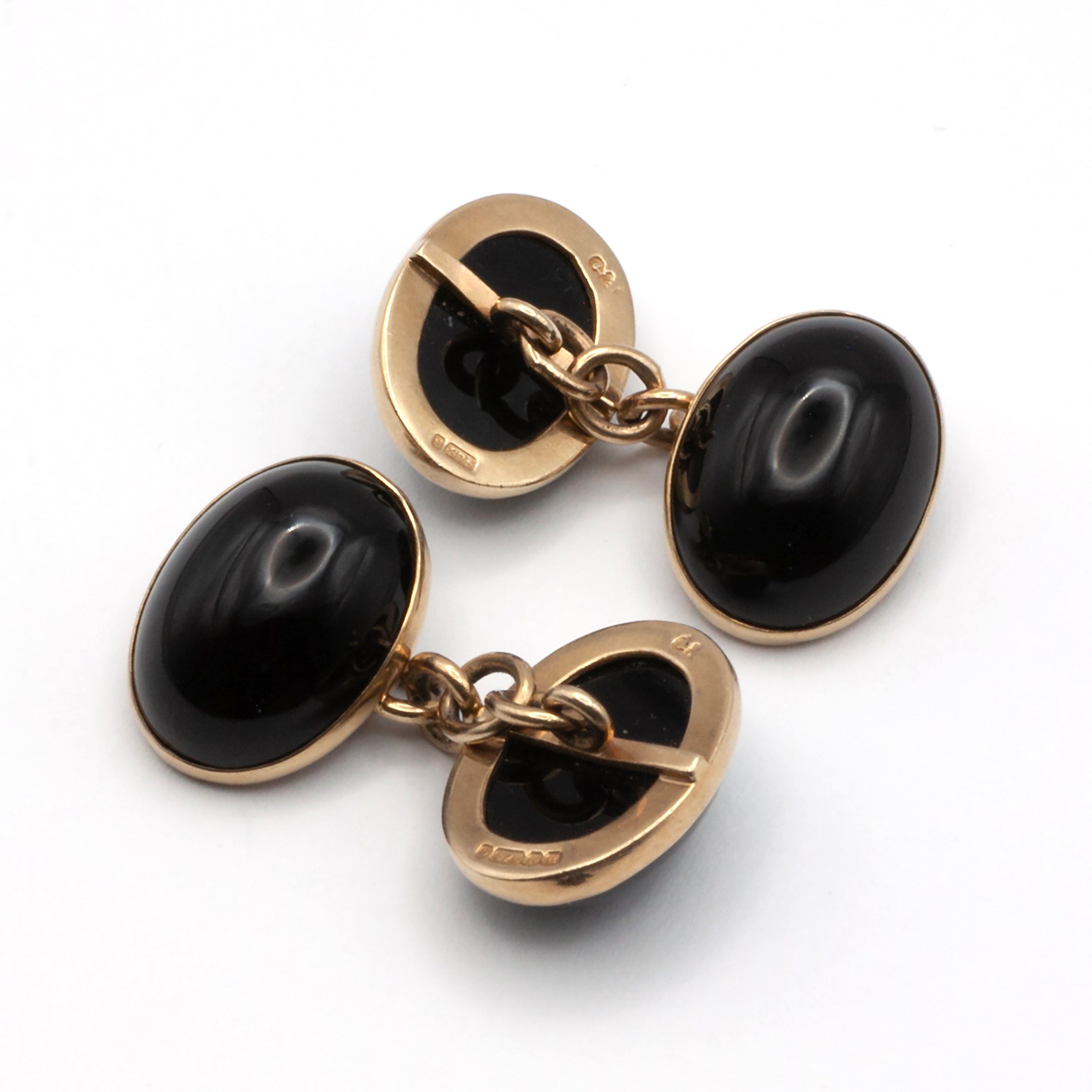 A vintage pair of 9ct gold onyx cuff links
