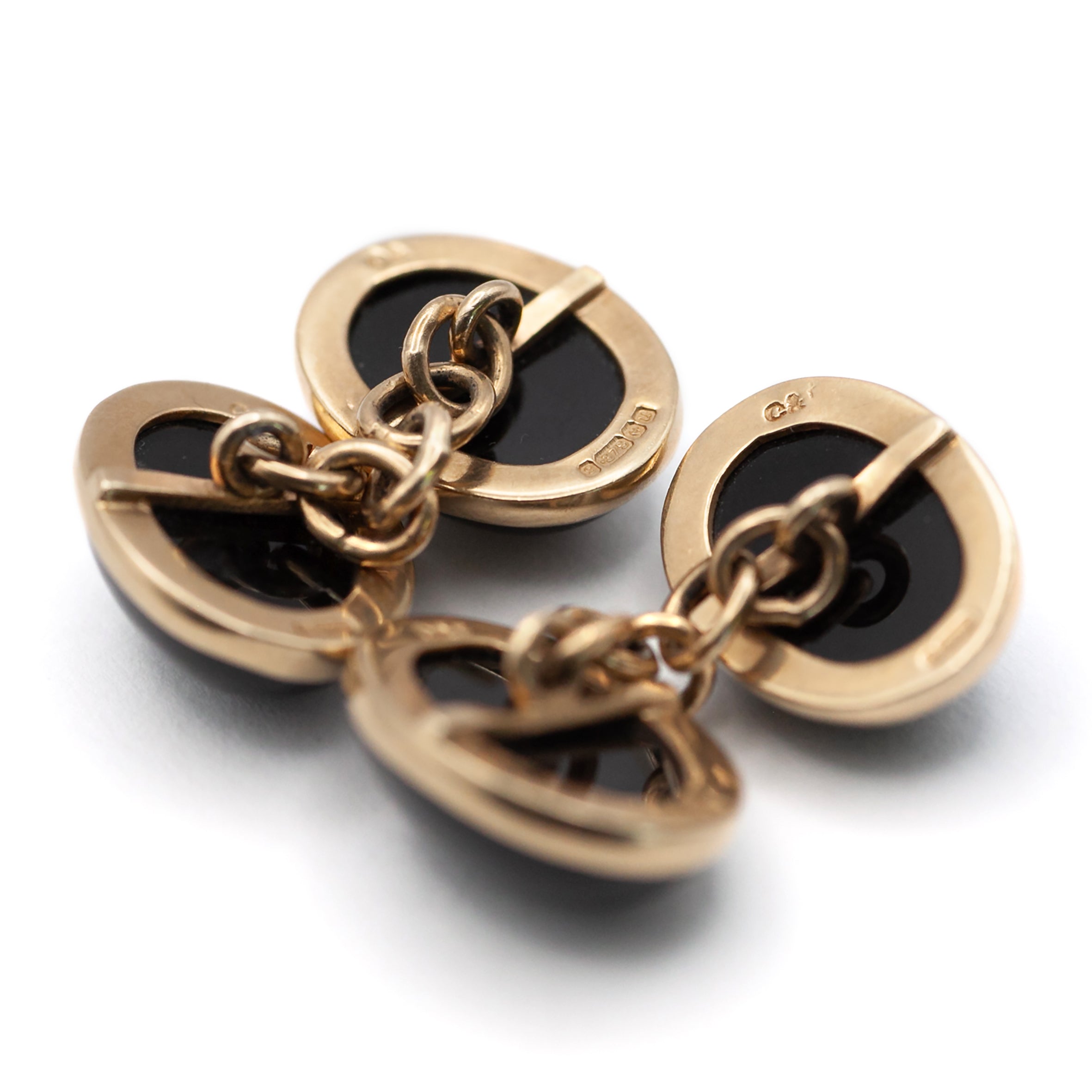 A vintage pair of 9ct gold onyx cuff links