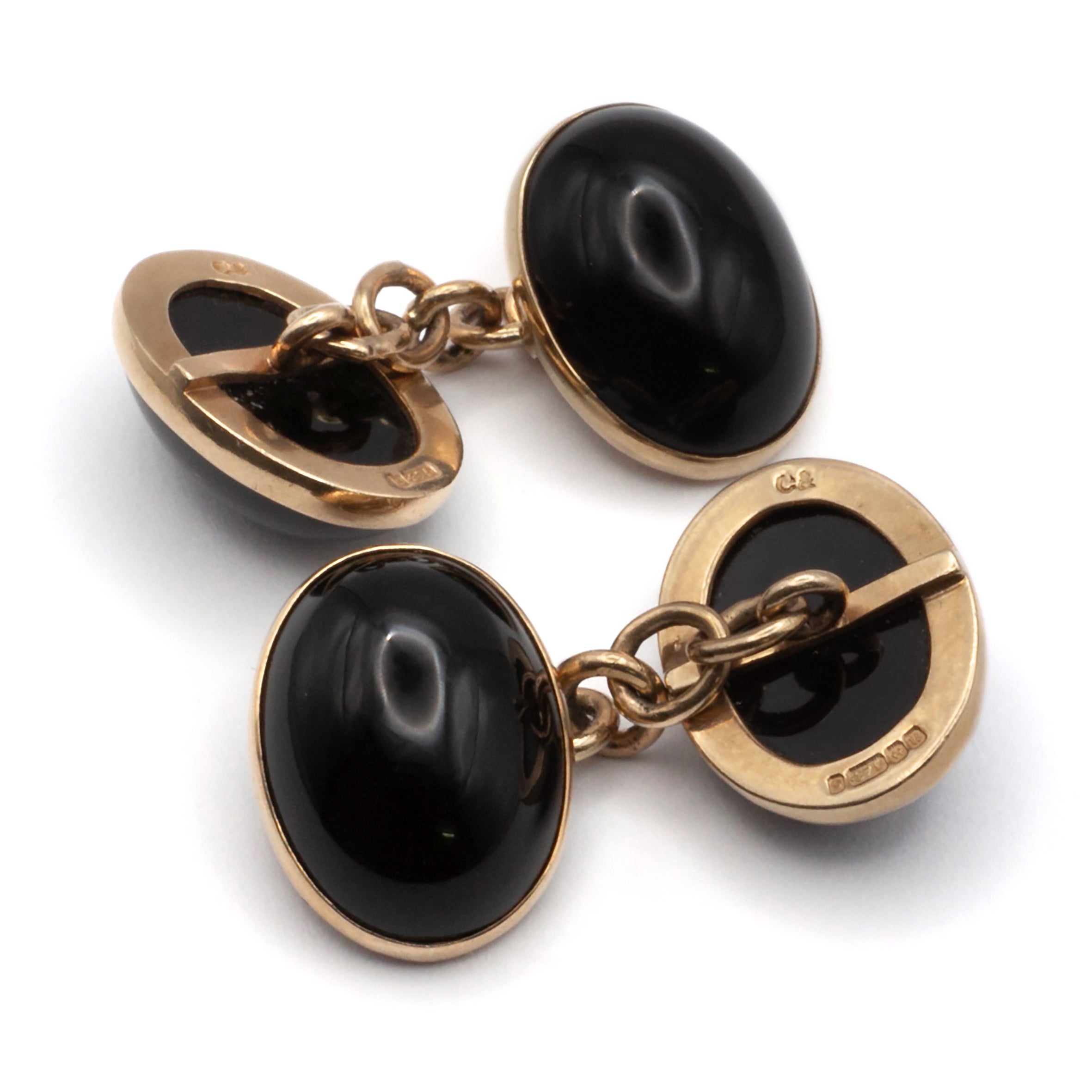 A vintage pair of 9ct gold onyx cuff links