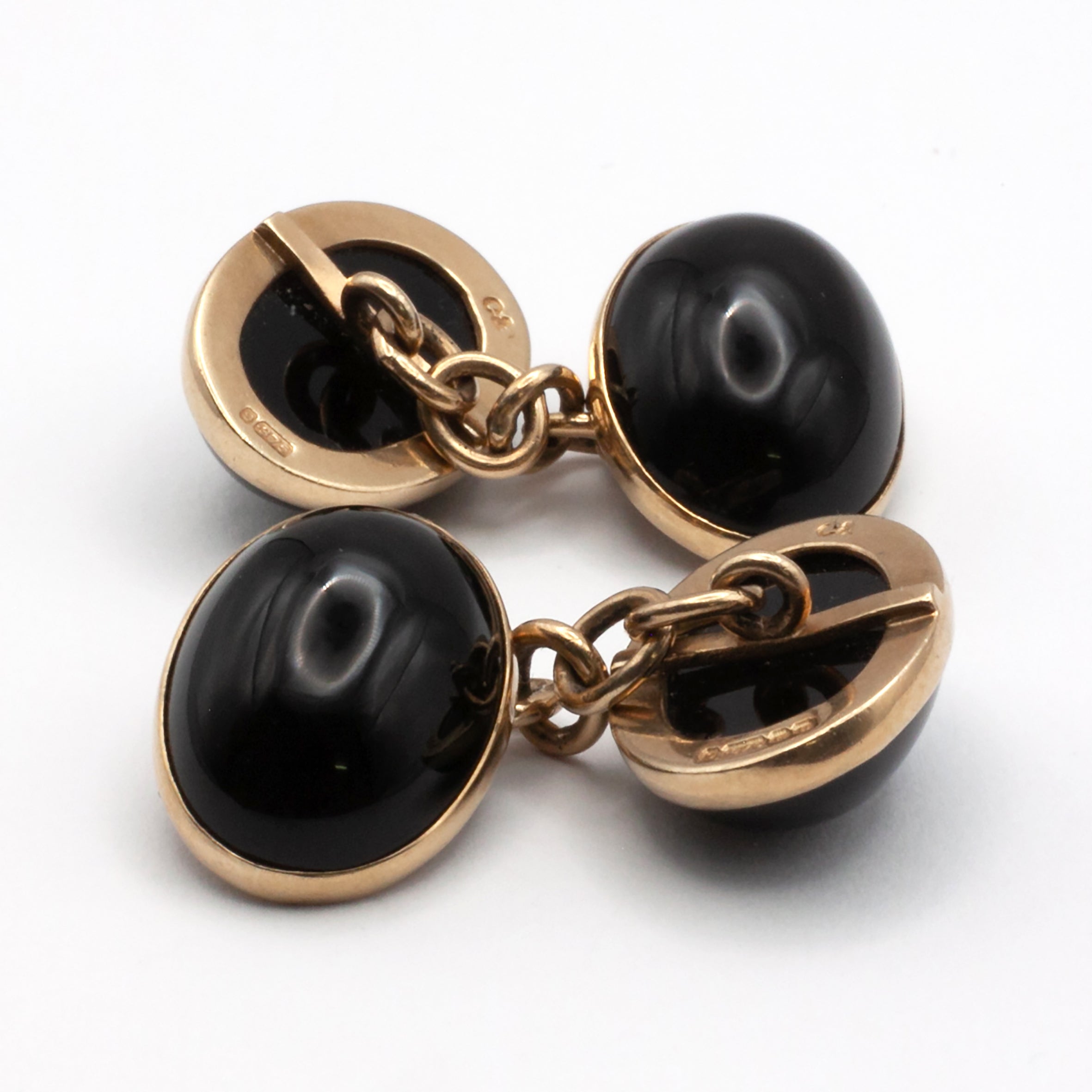 A vintage pair of 9ct gold onyx cuff links