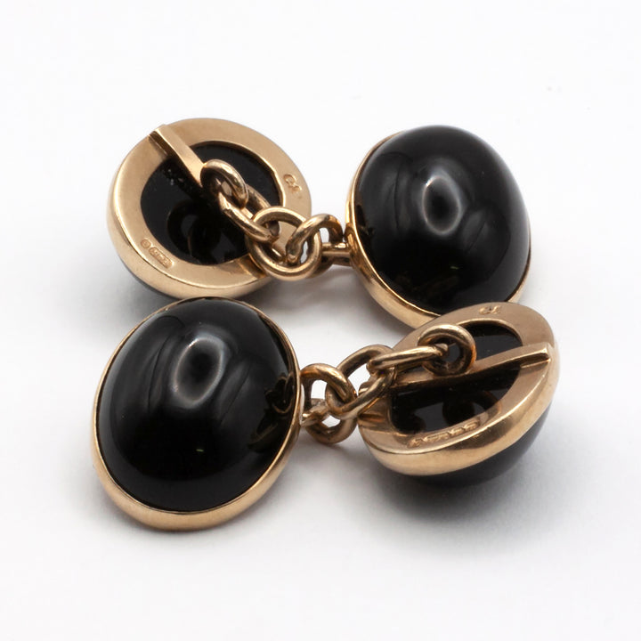 A vintage pair of 9ct gold onyx cuff links