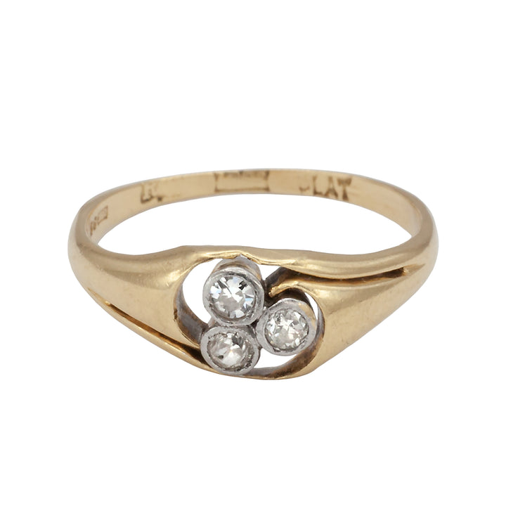 An 18ct gold and platinum three stone diamond ring