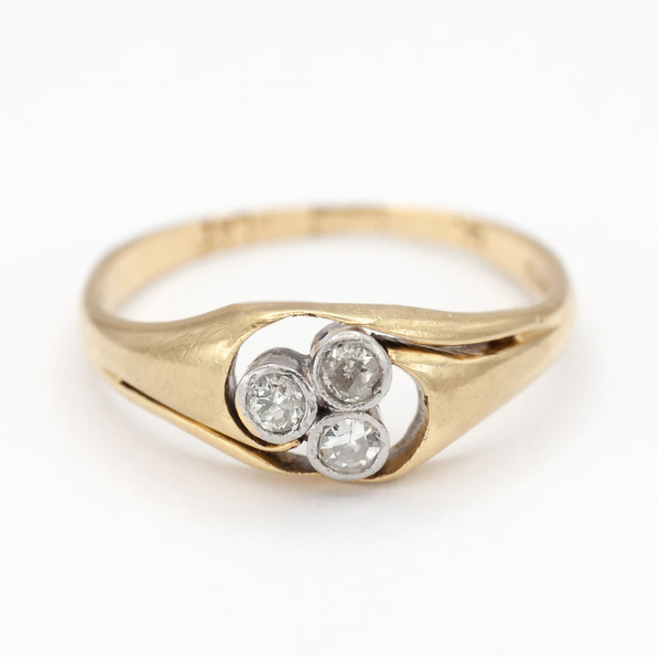 An 18ct gold and platinum three stone diamond ring