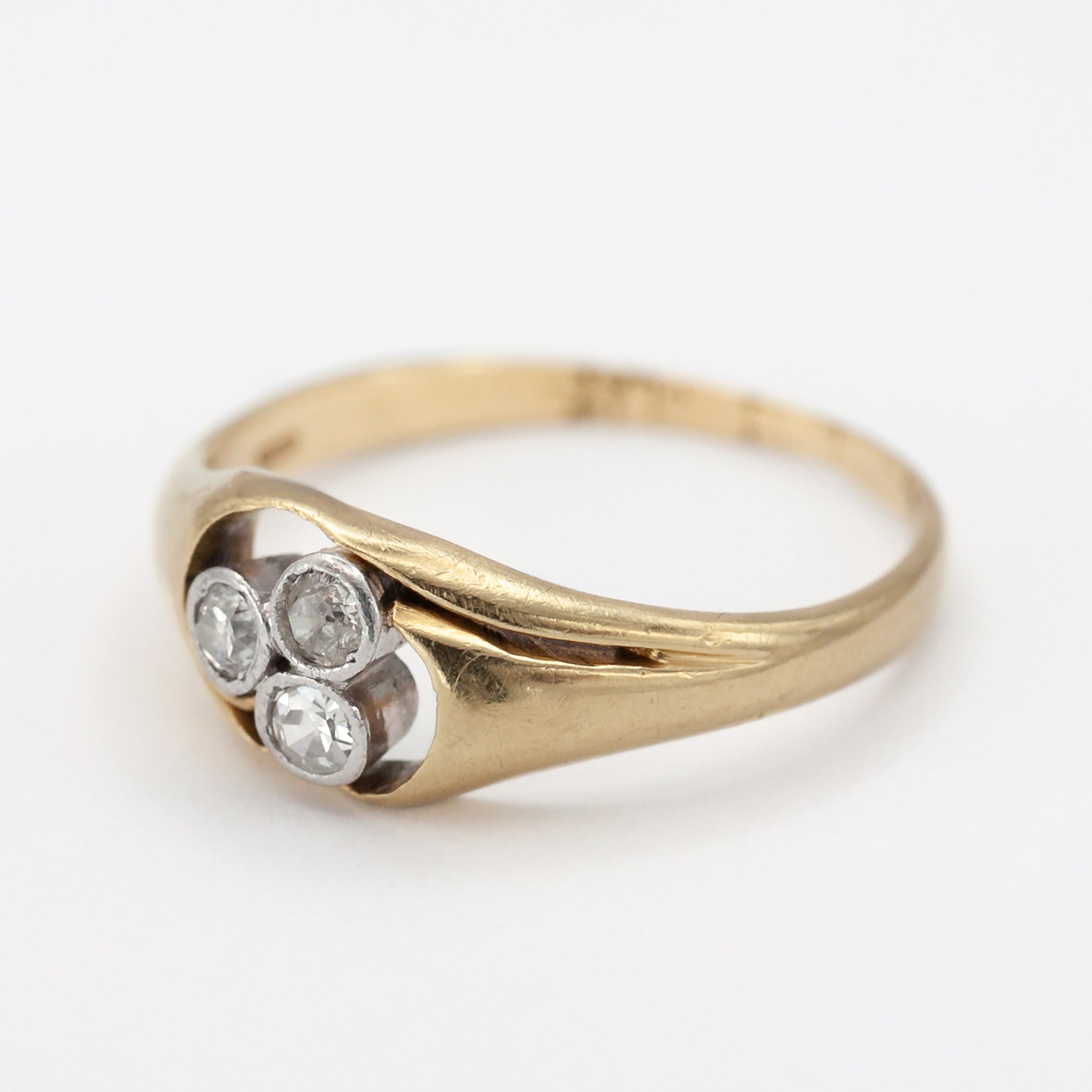 An 18ct gold and platinum three stone diamond ring