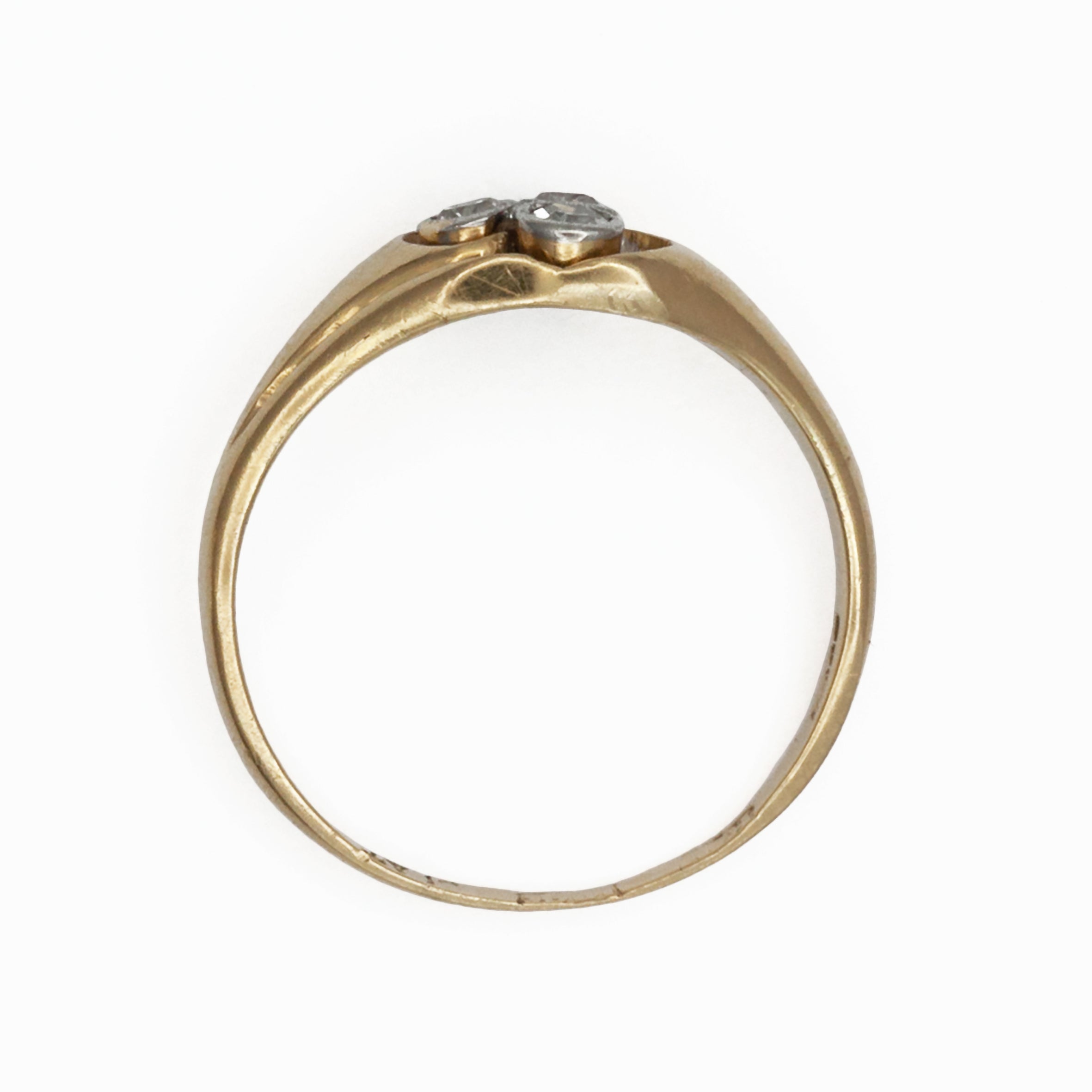 An 18ct gold and platinum three stone diamond ring
