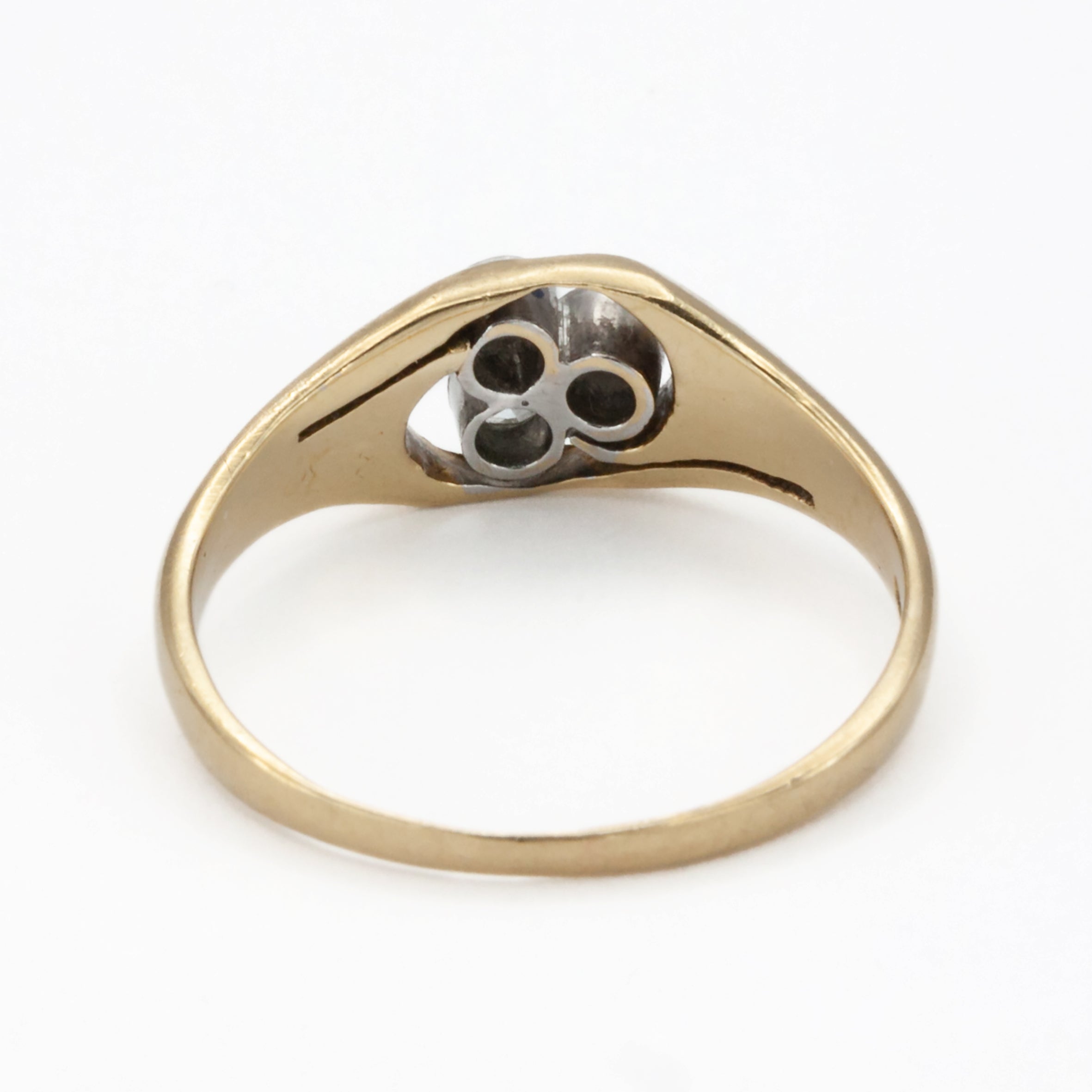An 18ct gold and platinum three stone diamond ring