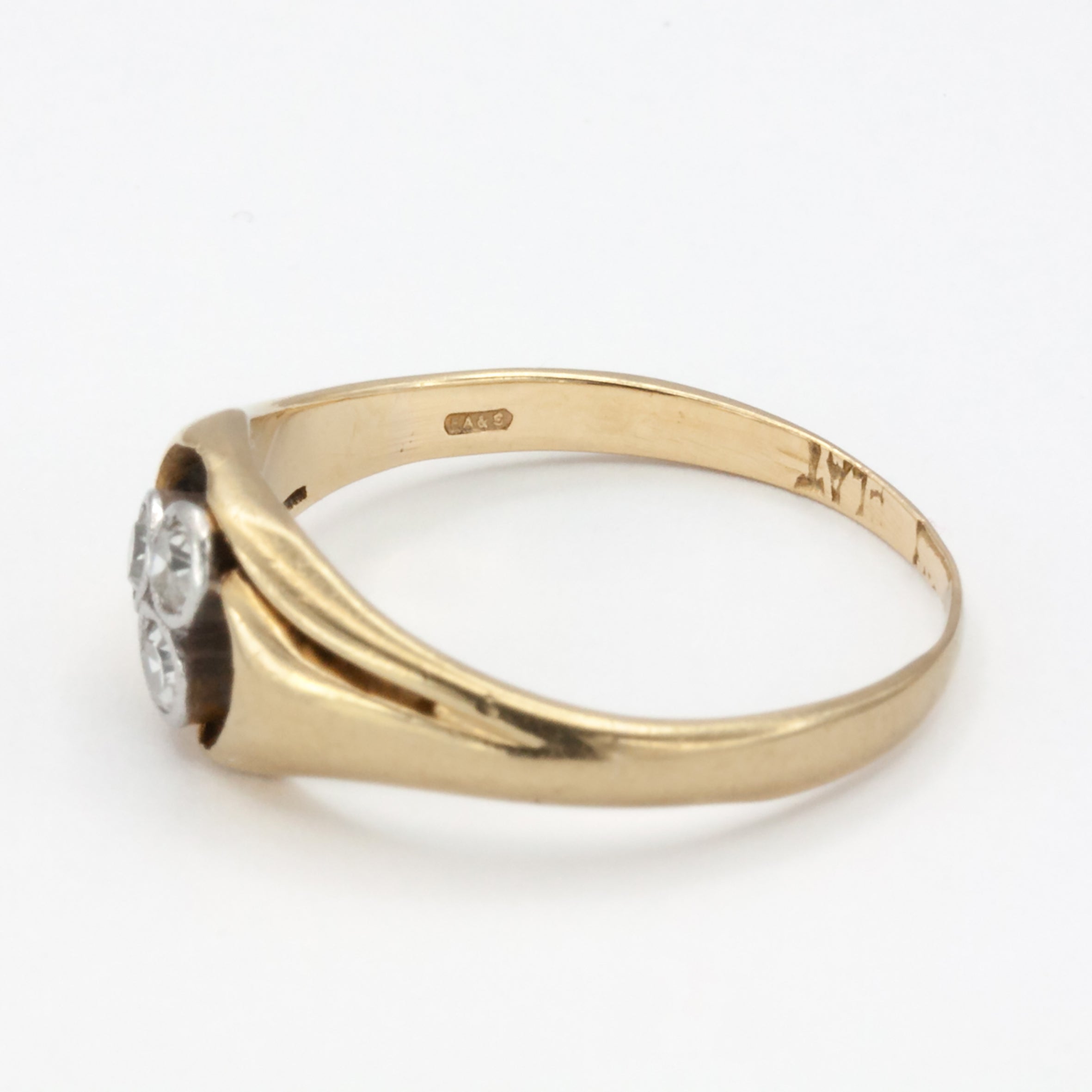 An 18ct gold and platinum three stone diamond ring