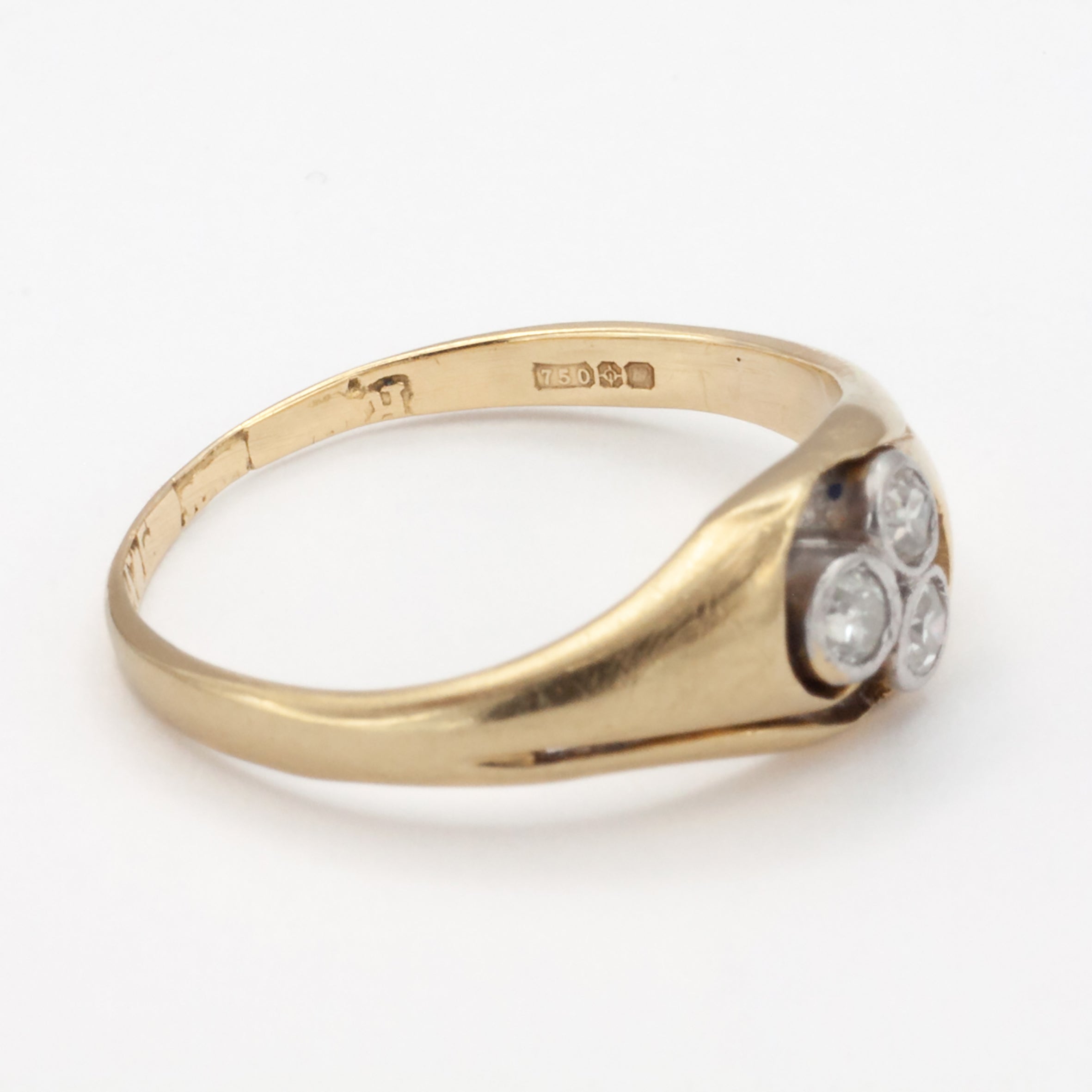 An 18ct gold and platinum three stone diamond ring