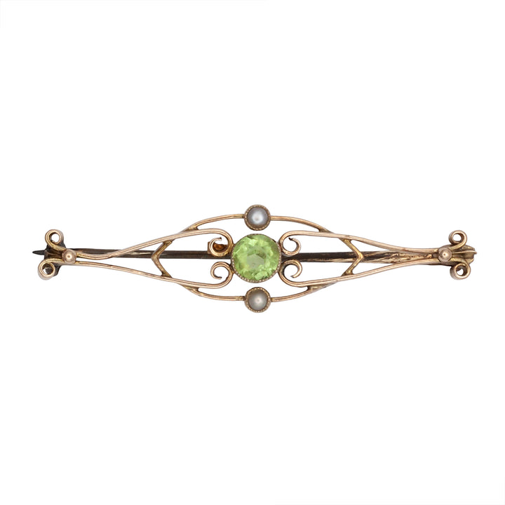 A 9ct gold peridot and seed pearl brooch