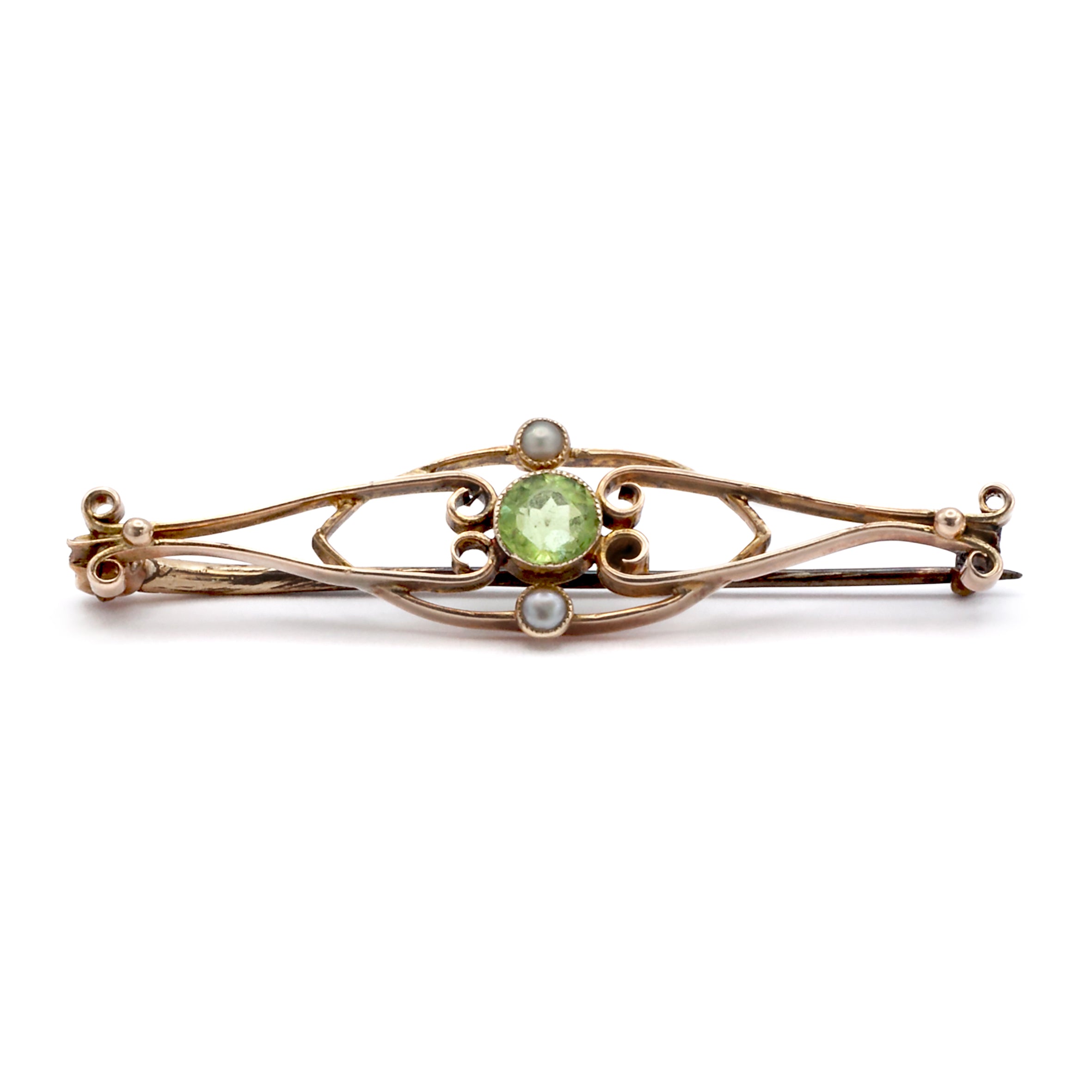 A 9ct gold peridot and seed pearl brooch