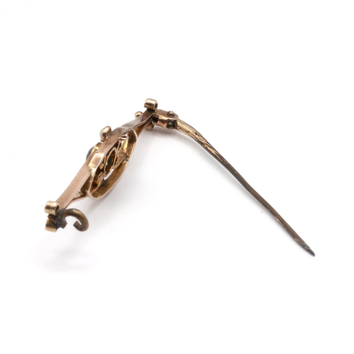 A 9ct gold peridot and seed pearl brooch