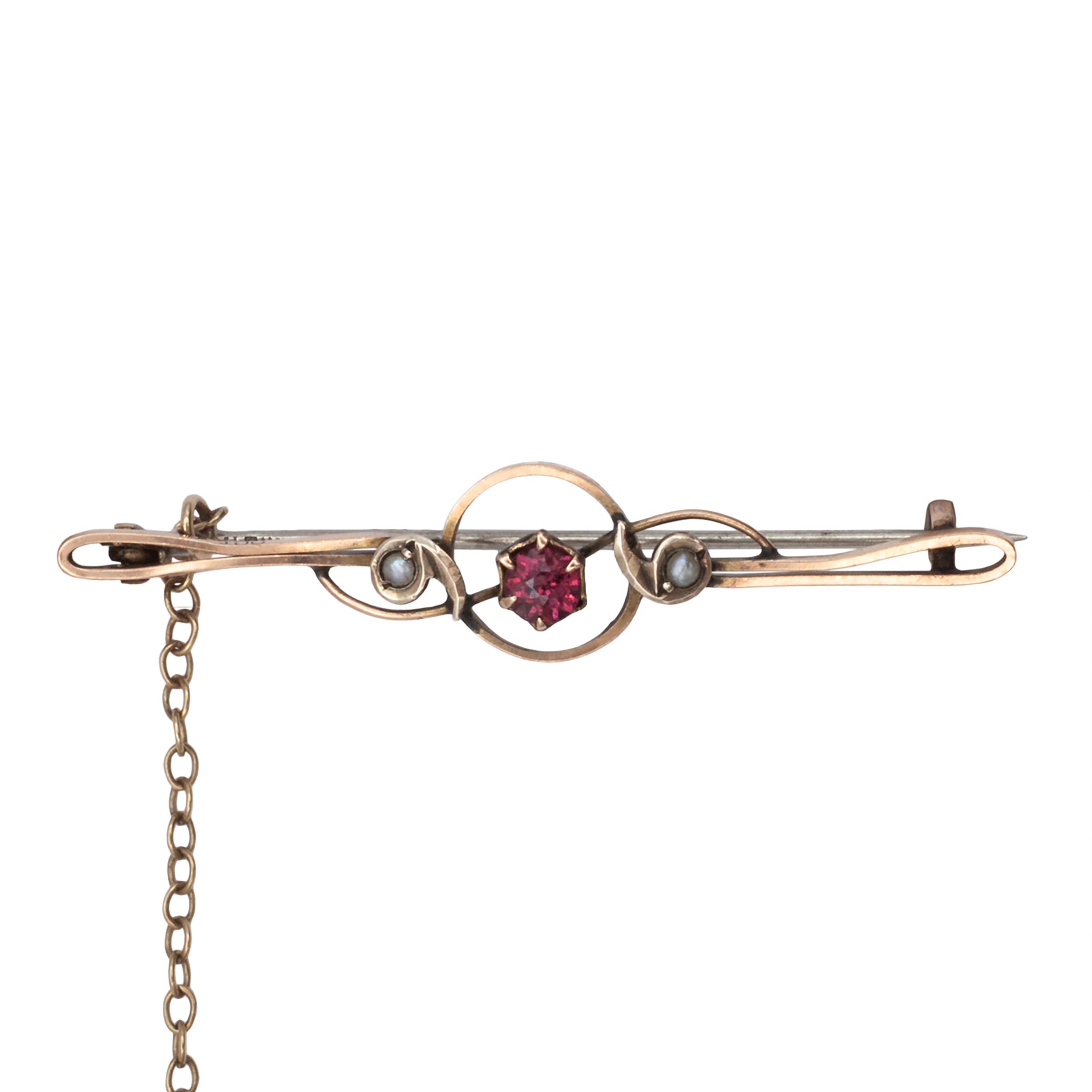 An antique 9ct gold ruby and pearl brooch