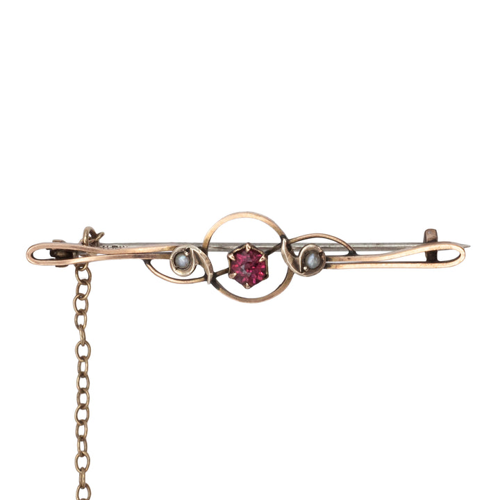An antique 9ct gold ruby and pearl brooch
