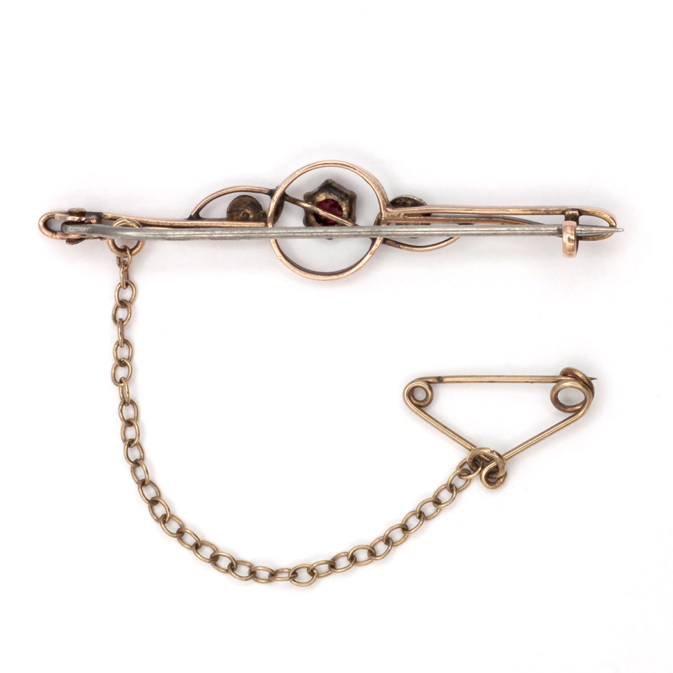 An antique 9ct gold ruby and pearl brooch