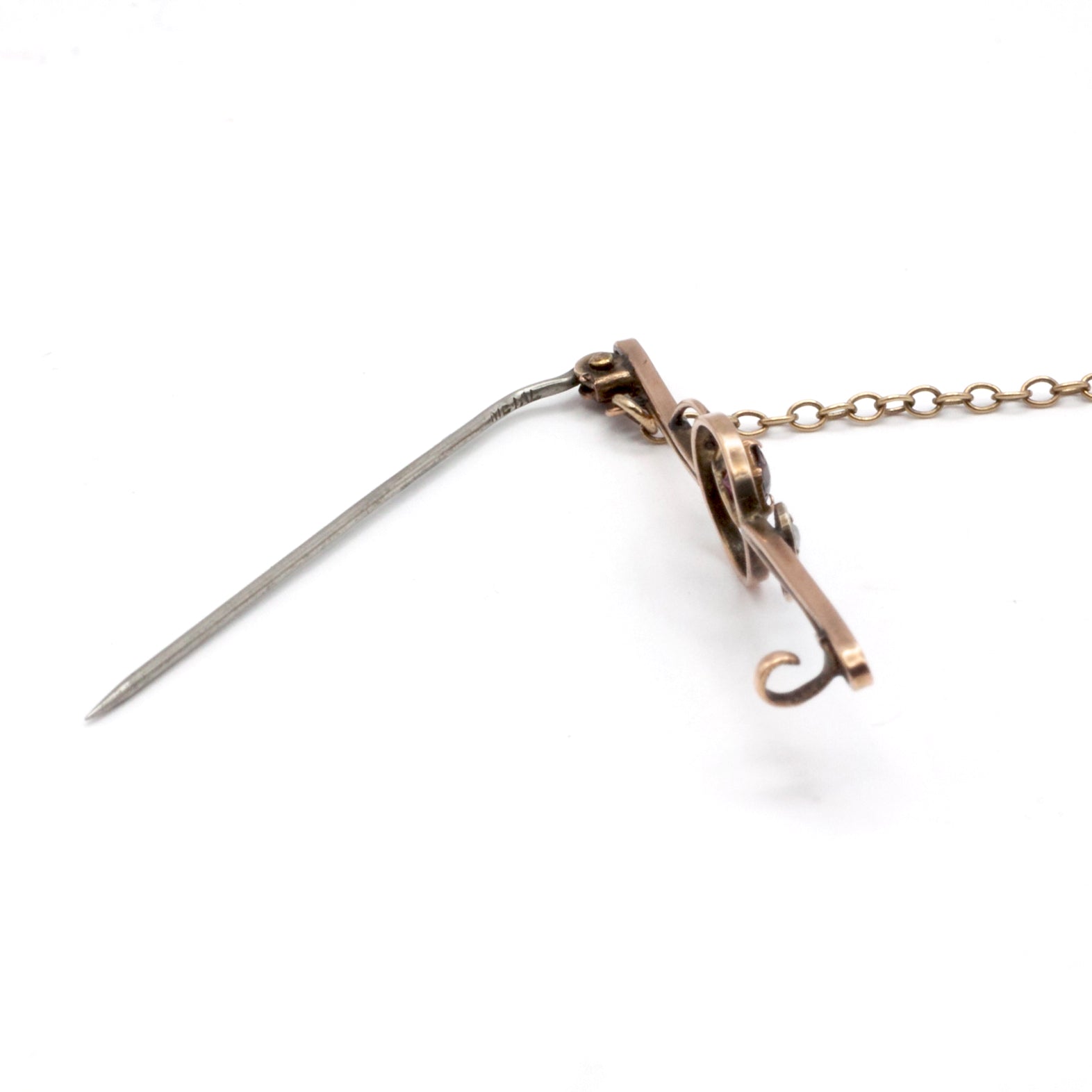 An antique 9ct gold ruby and pearl brooch