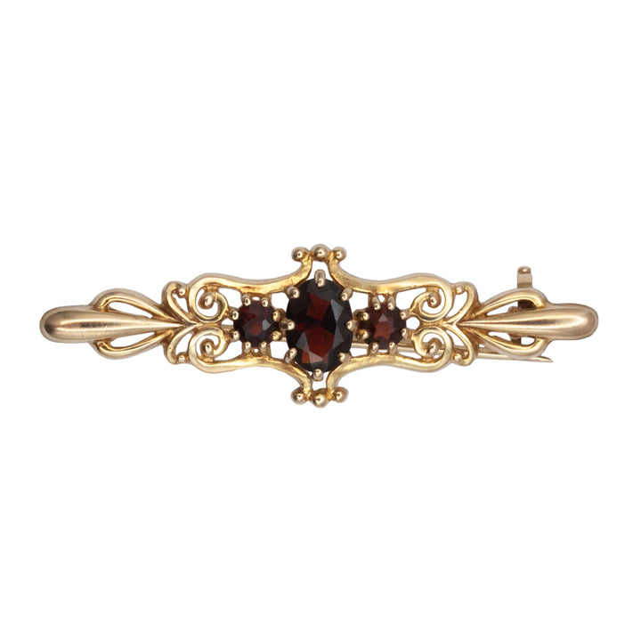 An antique 9ct gold garnet brooch