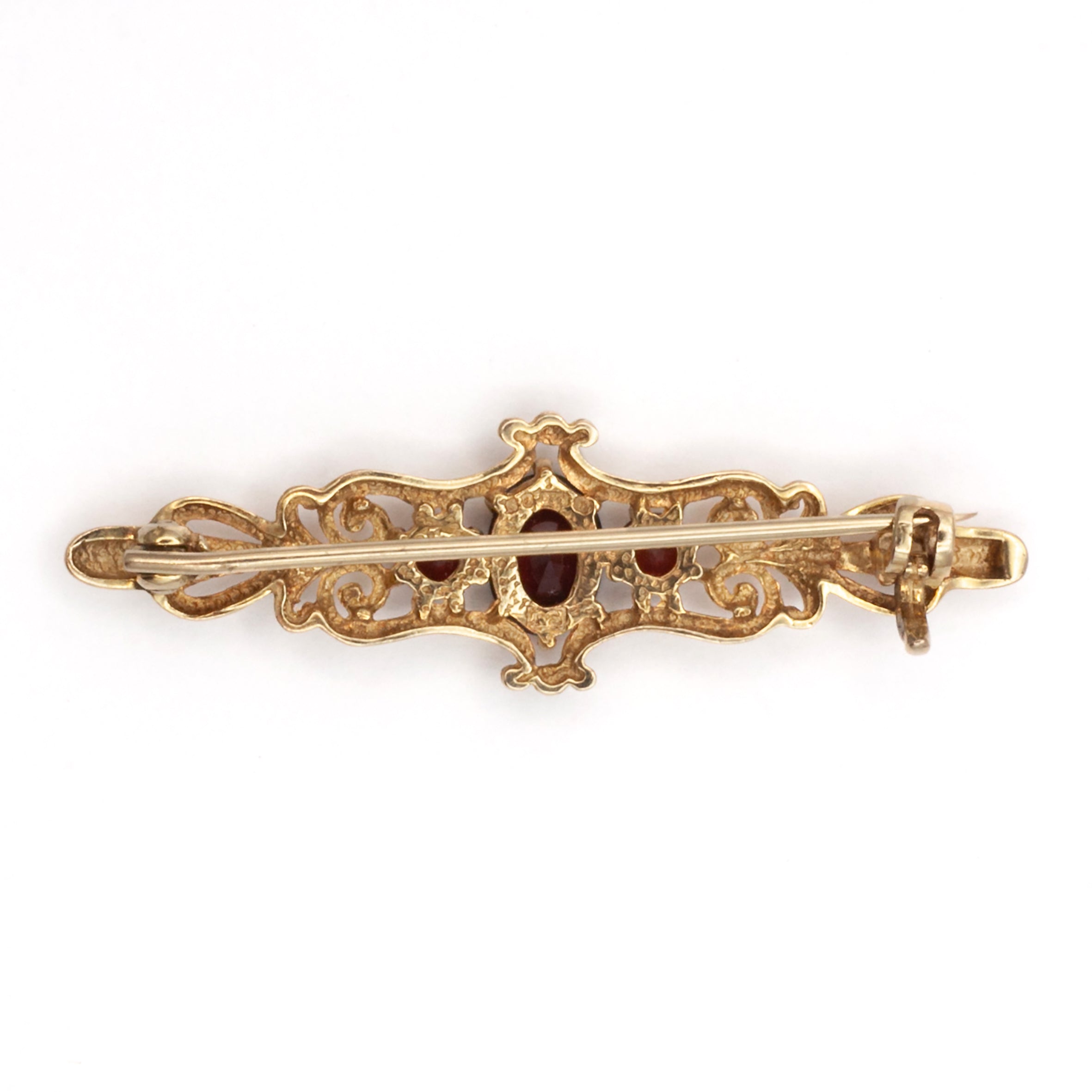 An antique 9ct gold garnet brooch