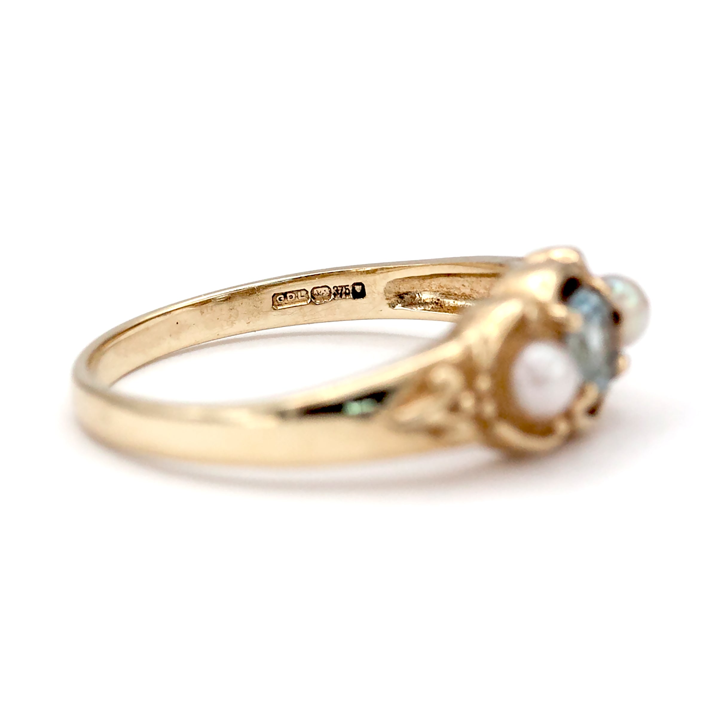 A 9ct gold topaz and pearl ring