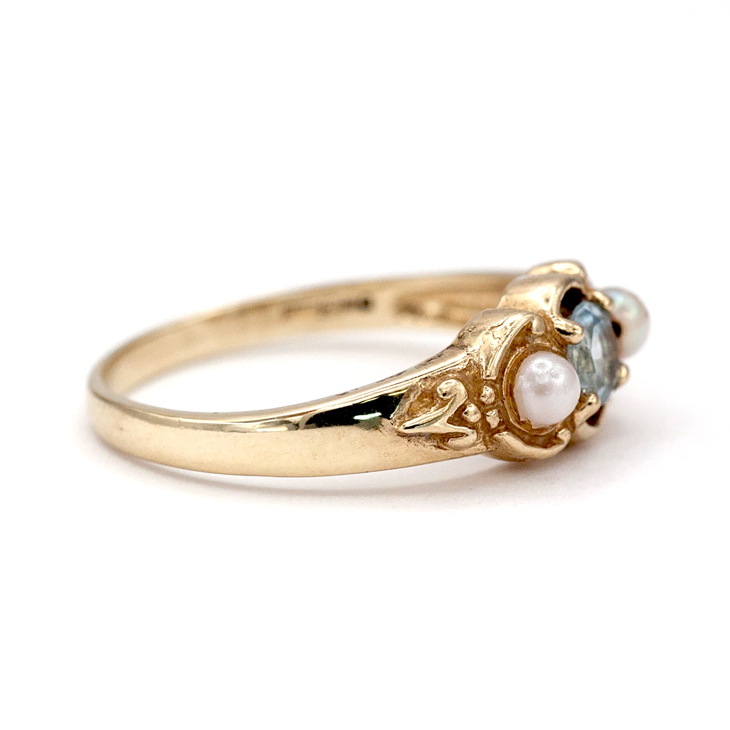 A 9ct gold topaz and pearl ring