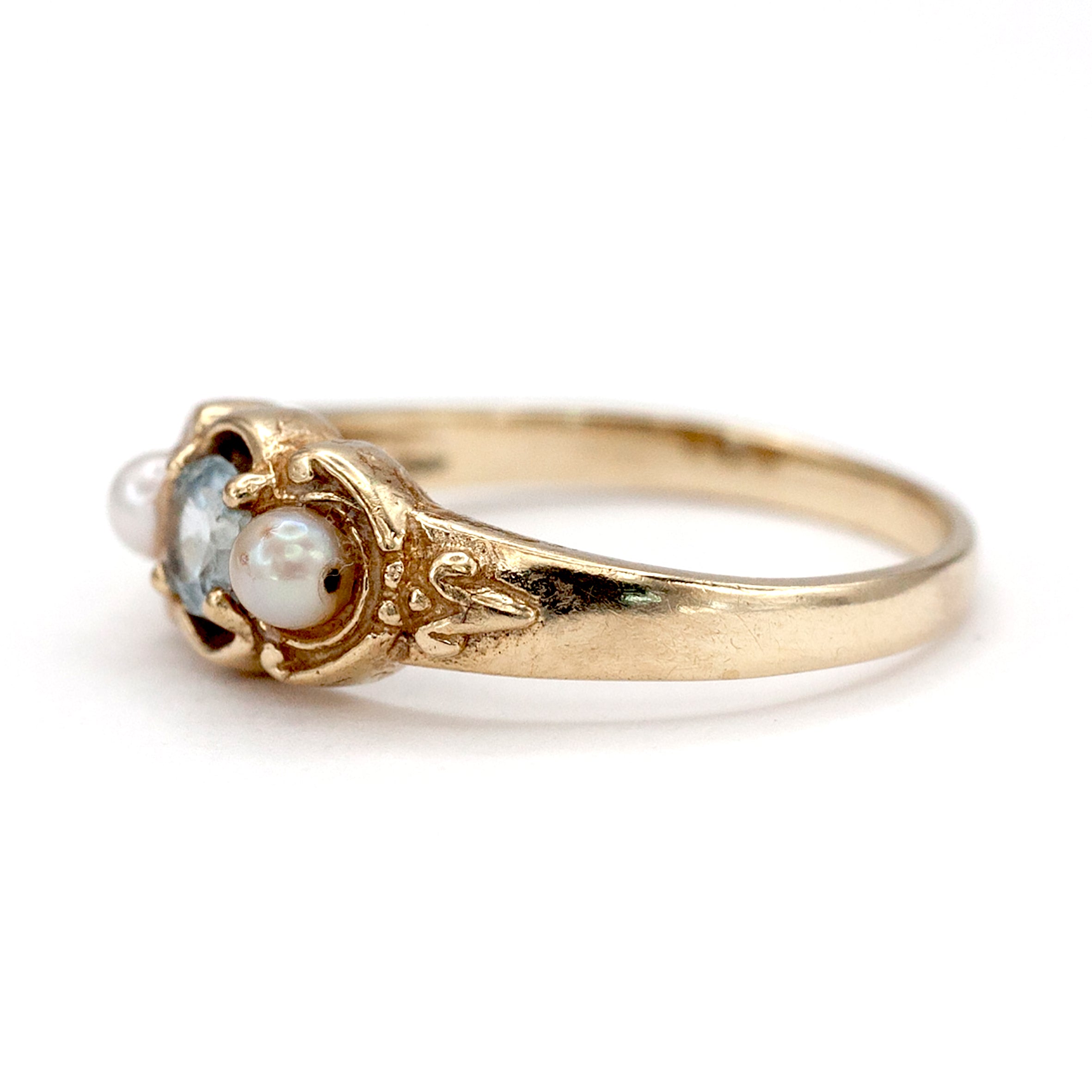 A 9ct gold topaz and pearl ring