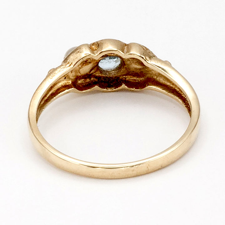 A 9ct gold topaz and pearl ring
