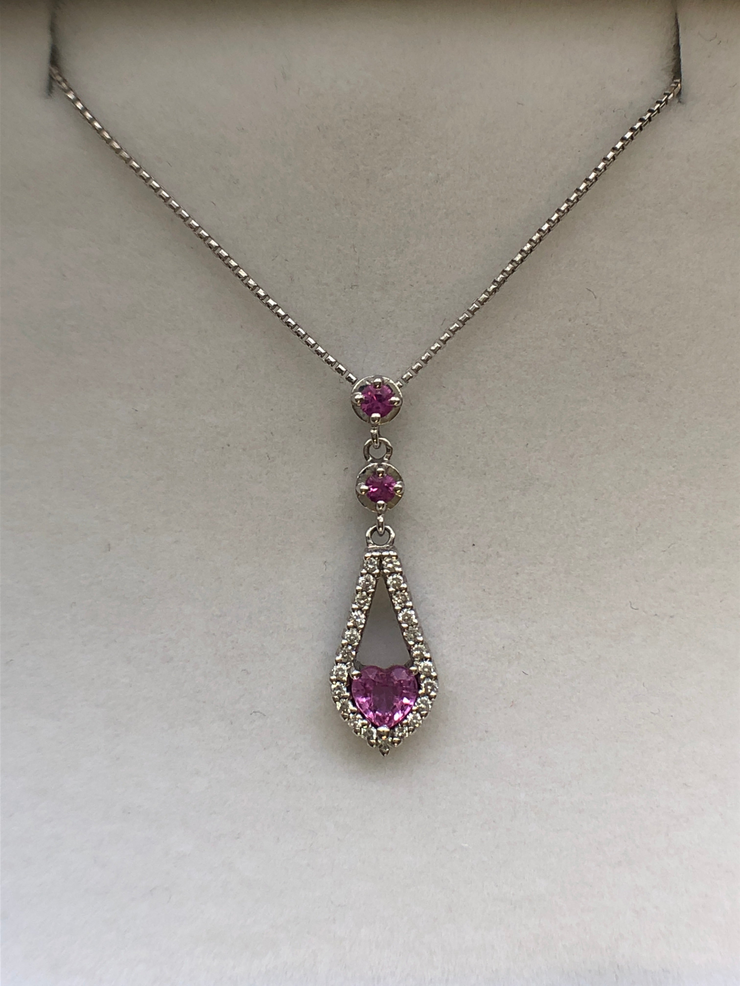 An 18ct white gold pink sapphire and diamond pendant