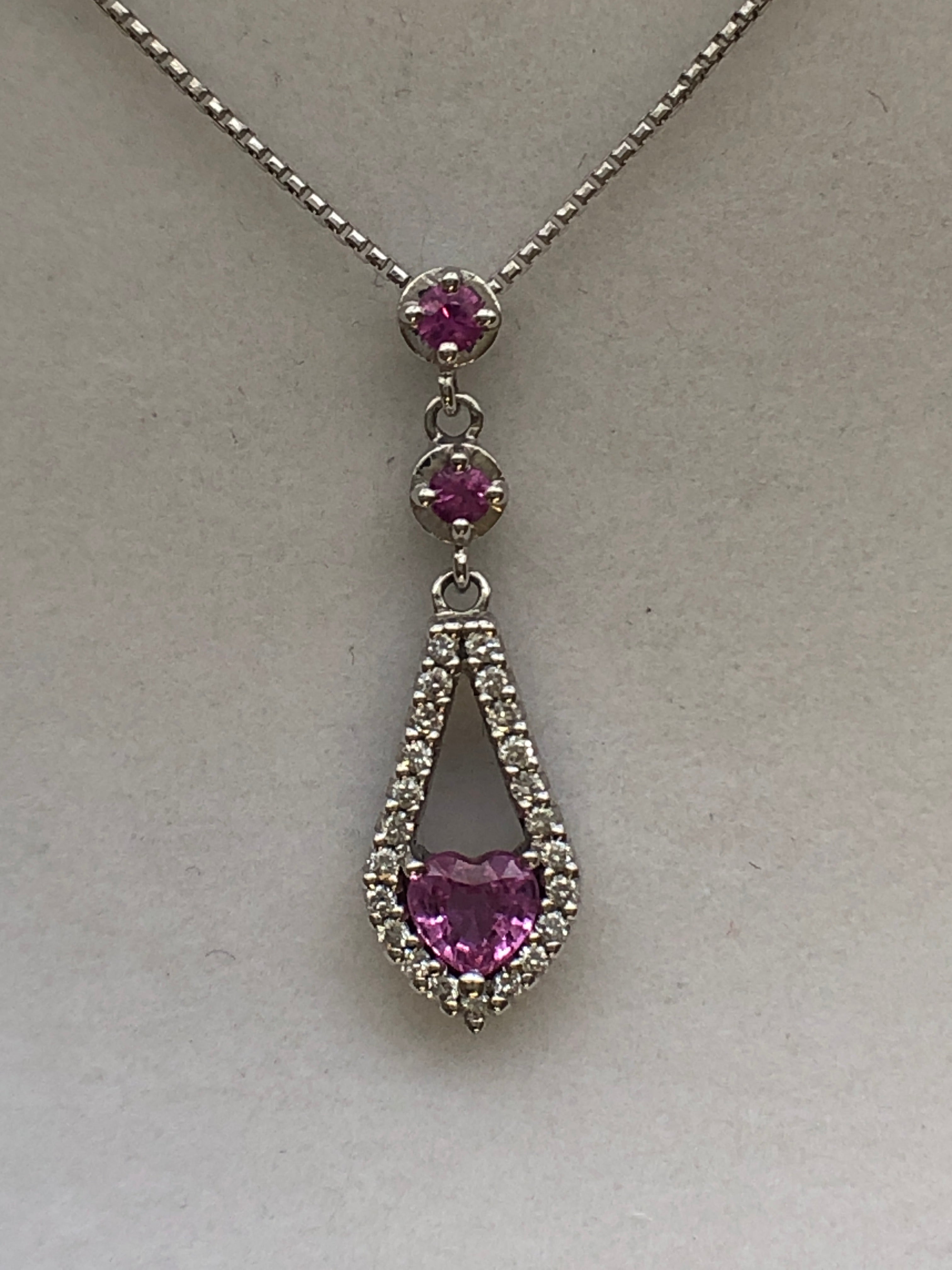 An 18ct white gold pink sapphire and diamond pendant