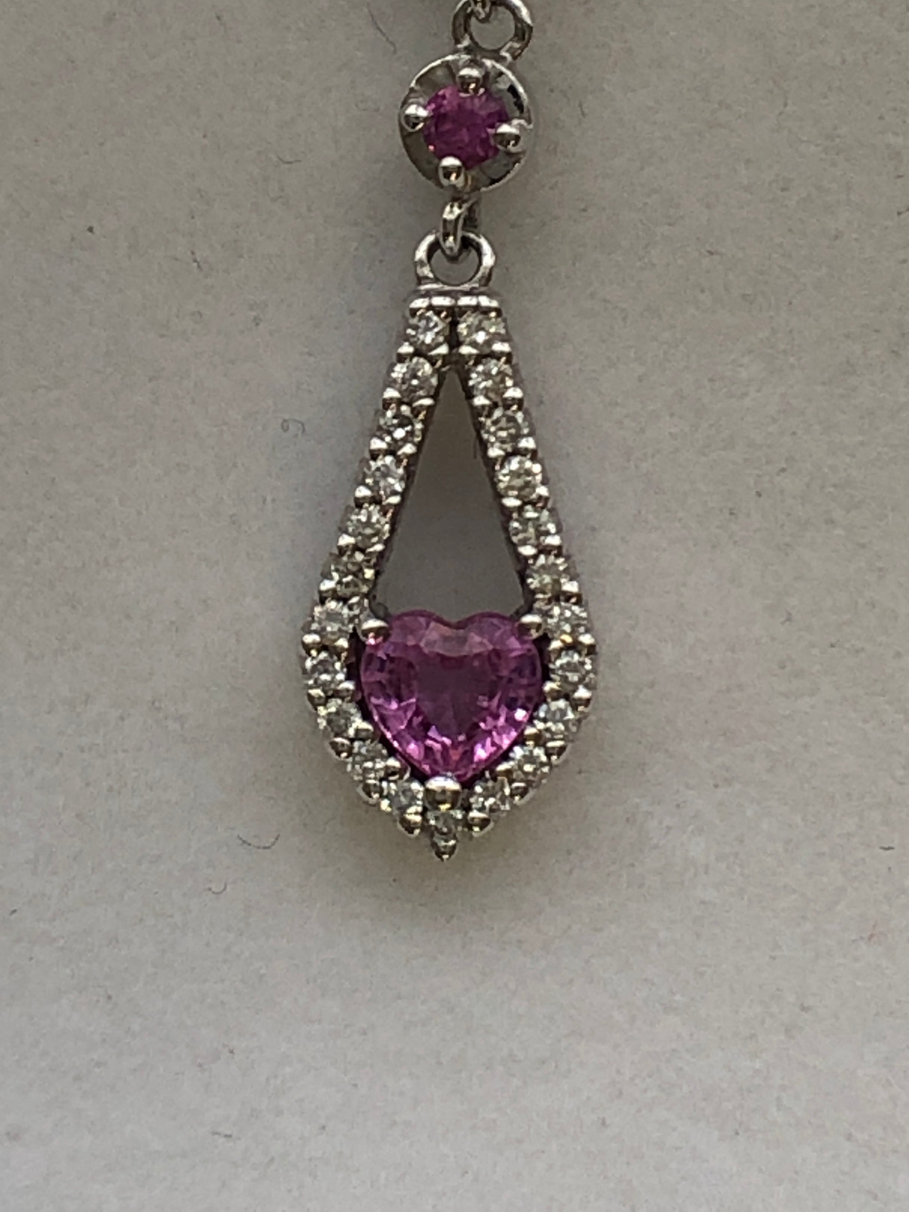 An 18ct white gold pink sapphire and diamond pendant