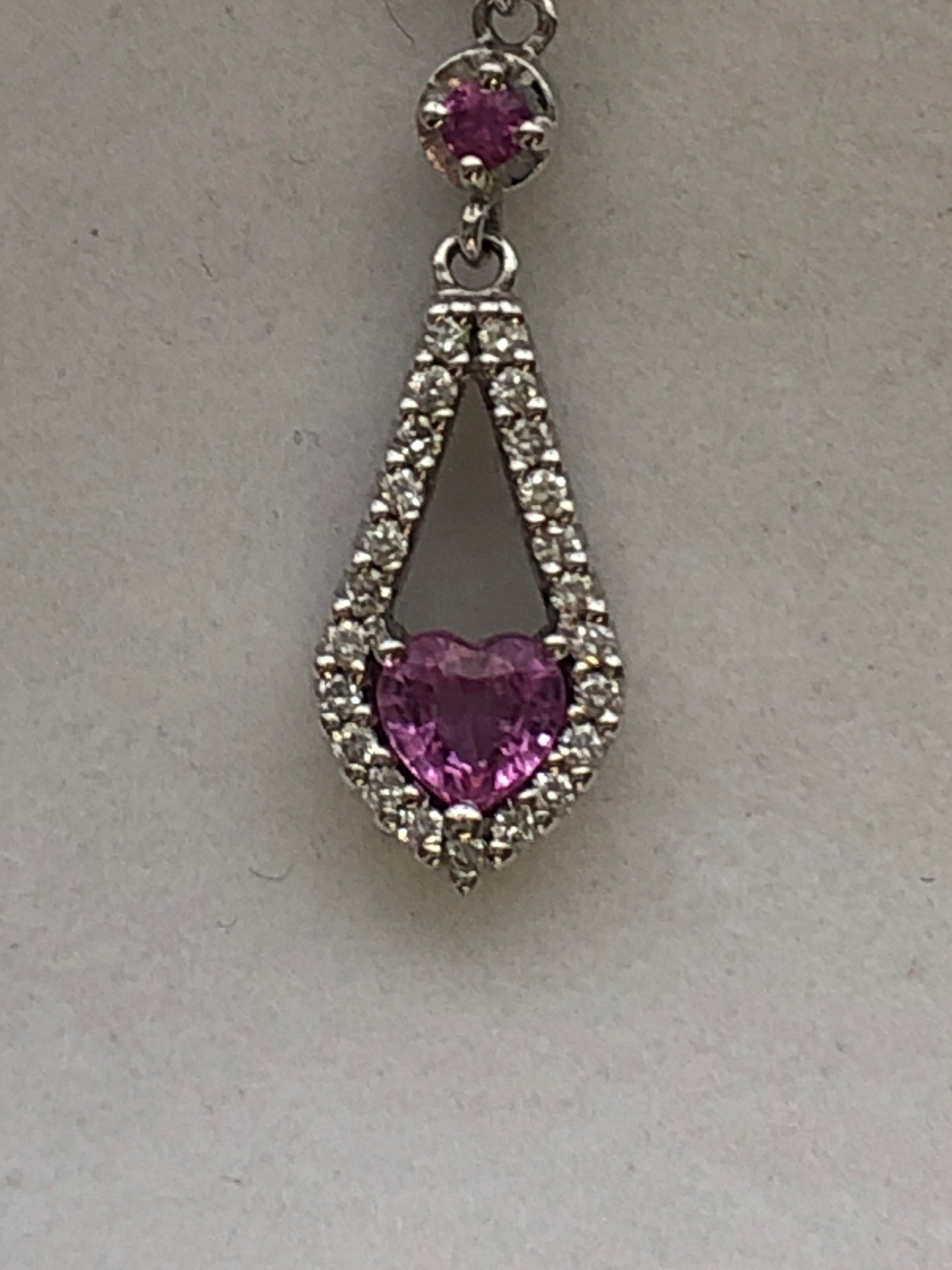 An 18ct white gold pink sapphire and diamond pendant