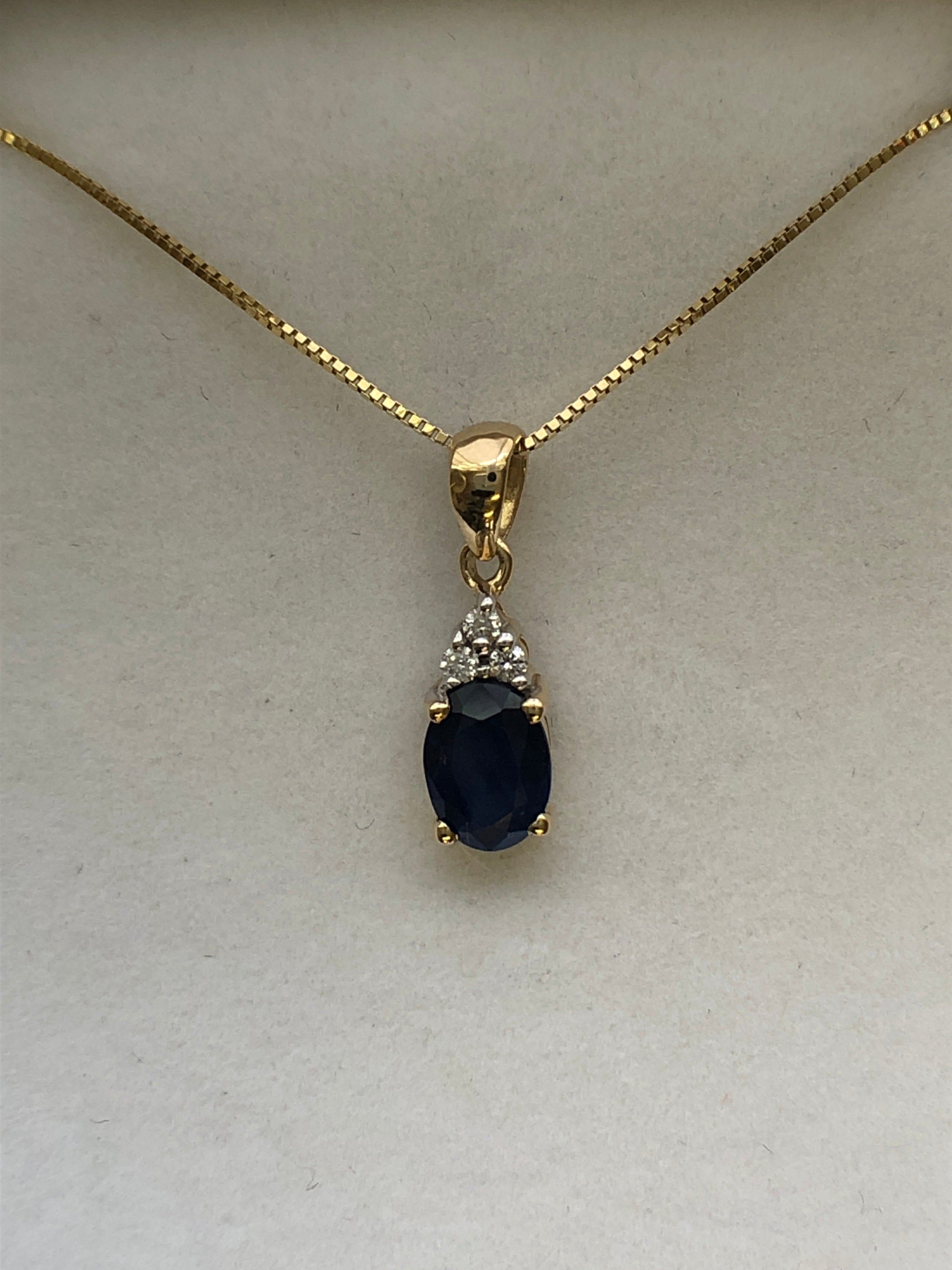 A 9ct gold sapphire and diamond pendant