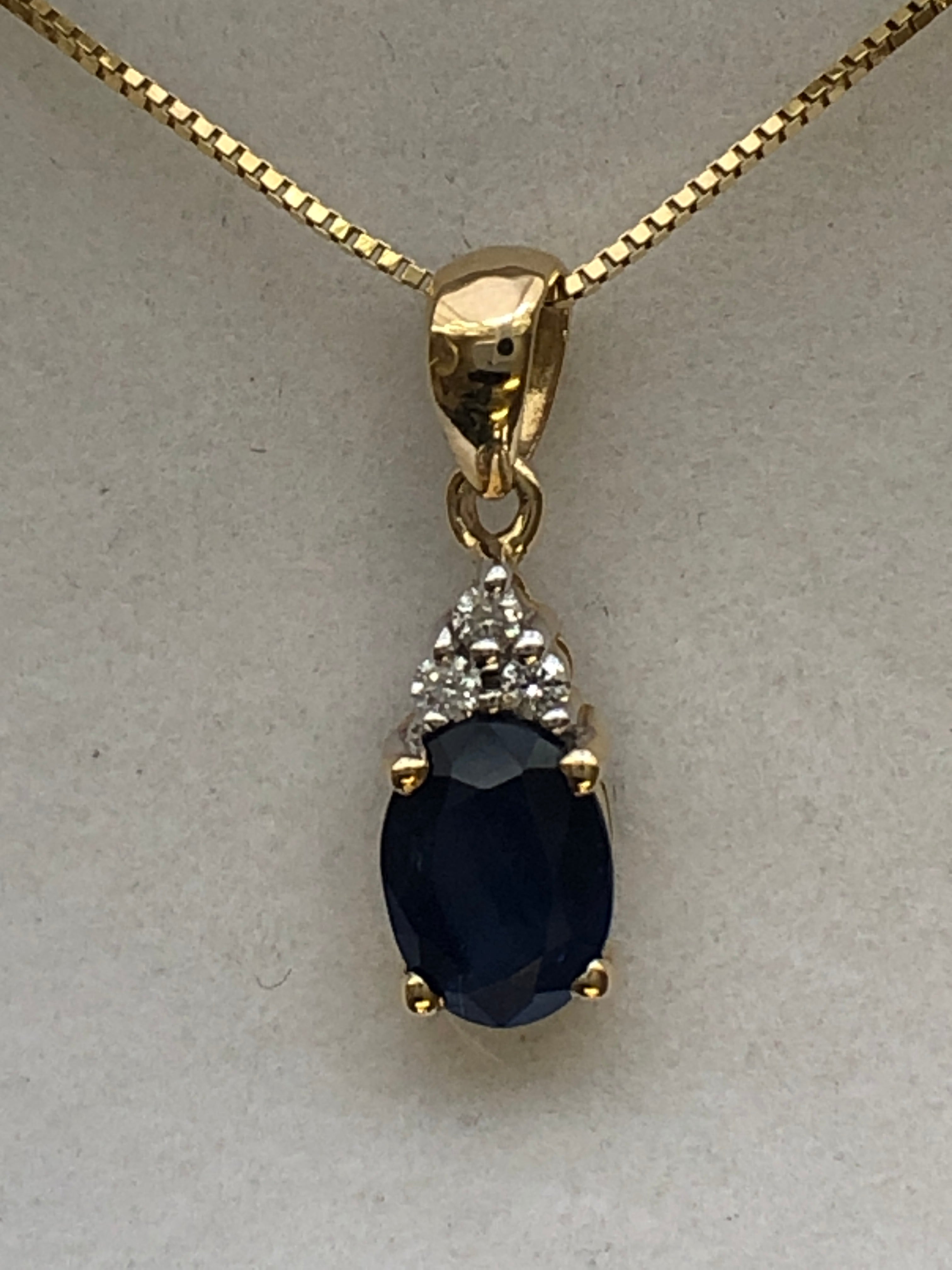 A 9ct gold sapphire and diamond pendant
