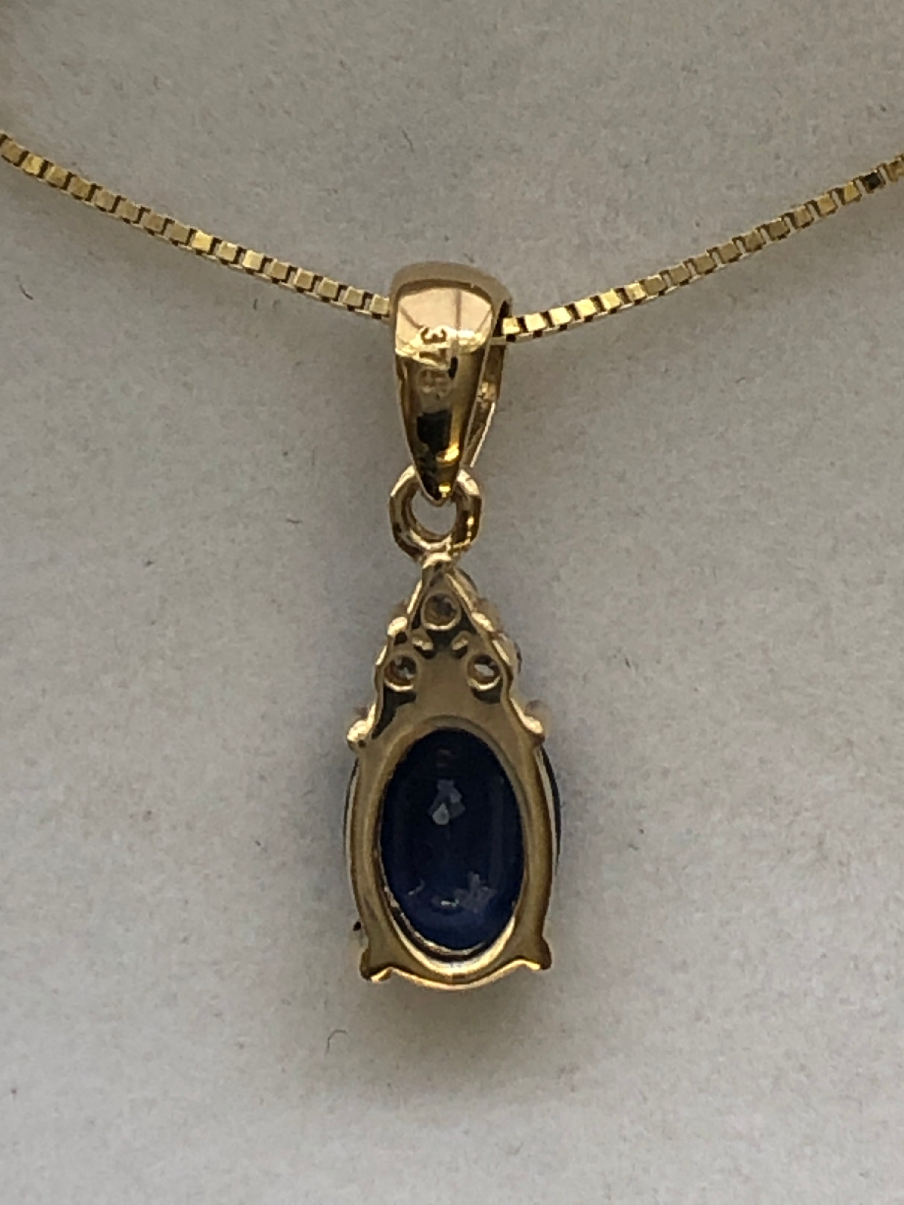 A 9ct gold sapphire and diamond pendant